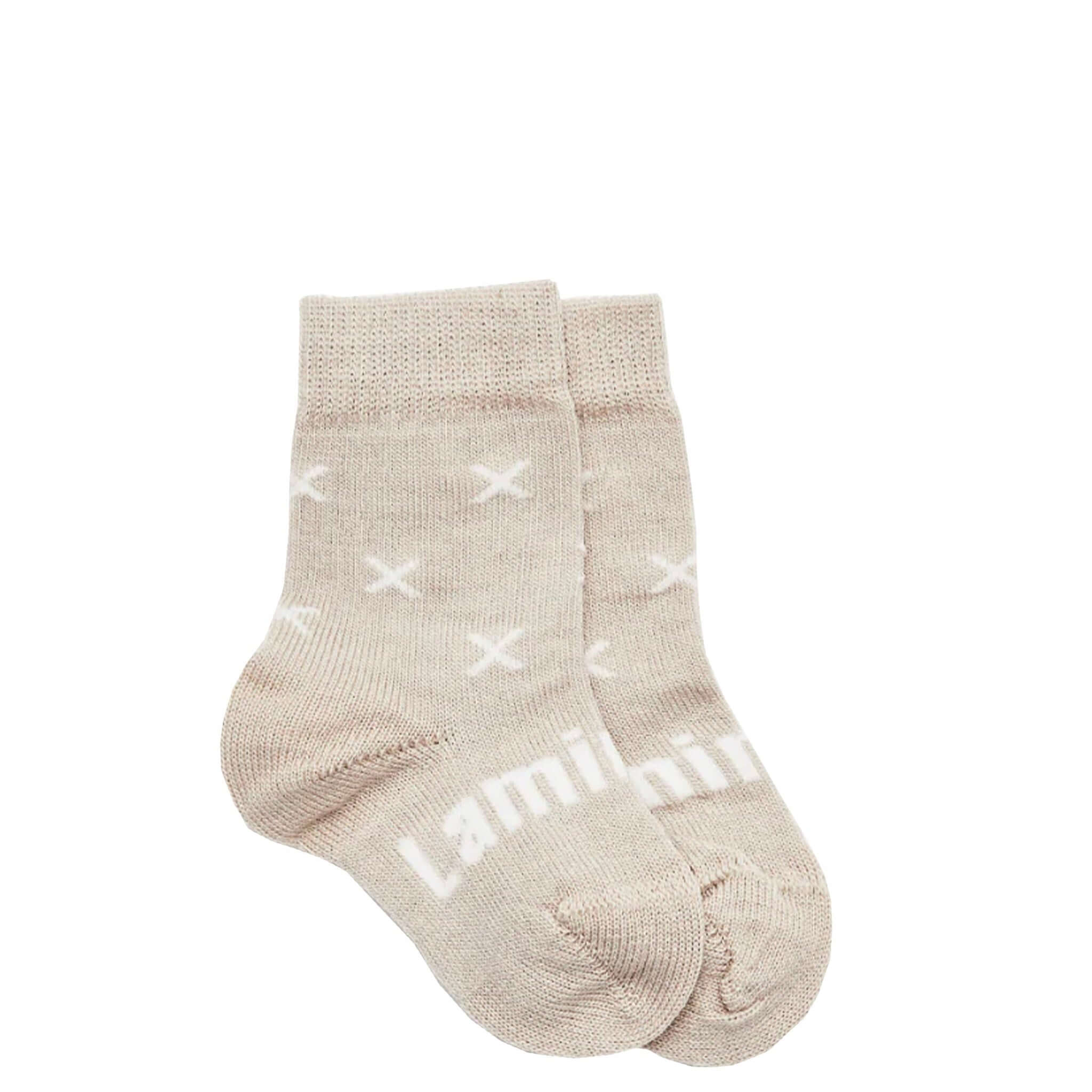 Lamington Merino Crew Baby Socks - Ted in oat color with white cross motifs, perfect for keeping tiny feet warm.