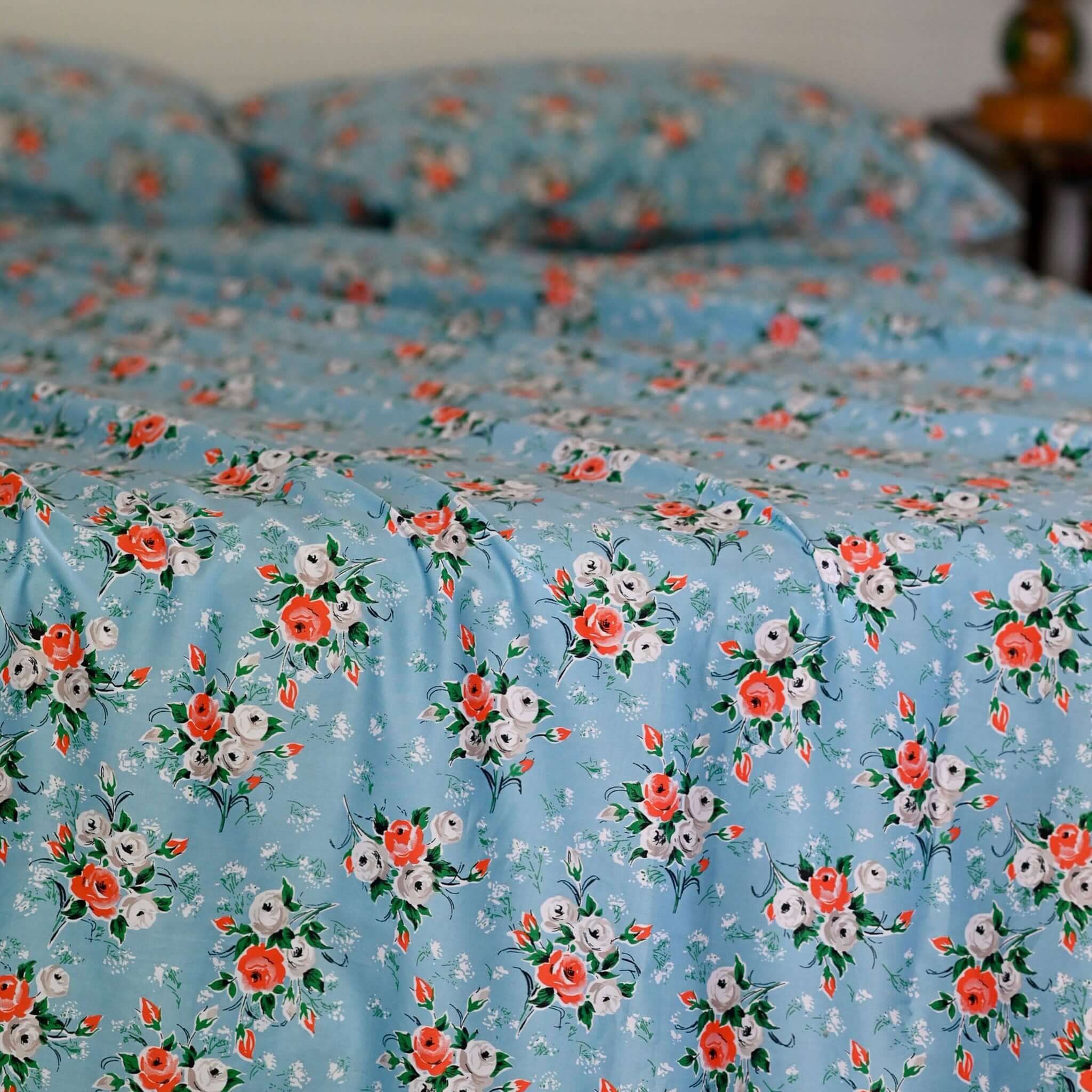 Alt Tag: Lazybones Organic Cotton Bedlinen Set - Rosebank vintage rose print bedlinen set, sky blue with coral, grey and white floral design