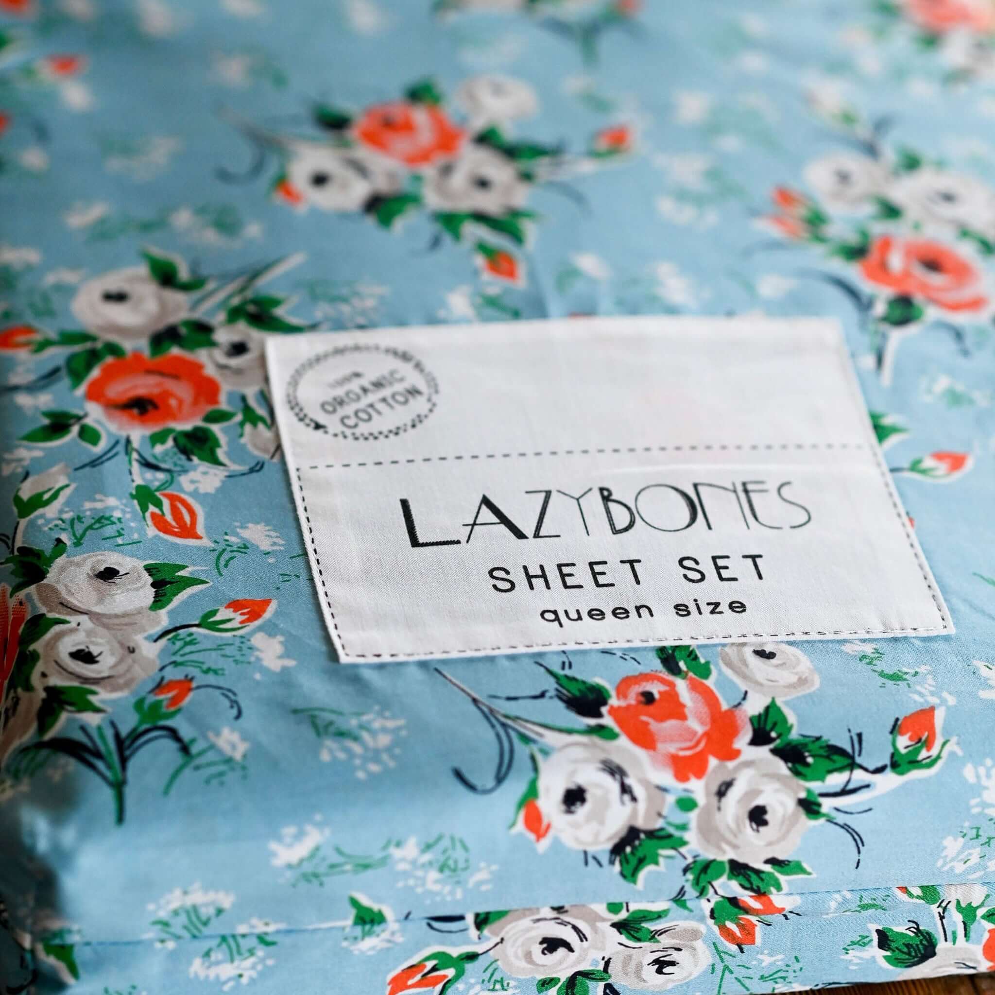 Alt Tag: Lazybones Organic Cotton Bedlinen Set - Rosebank queen sheet set with sky blue vintage rose print organic cotton label