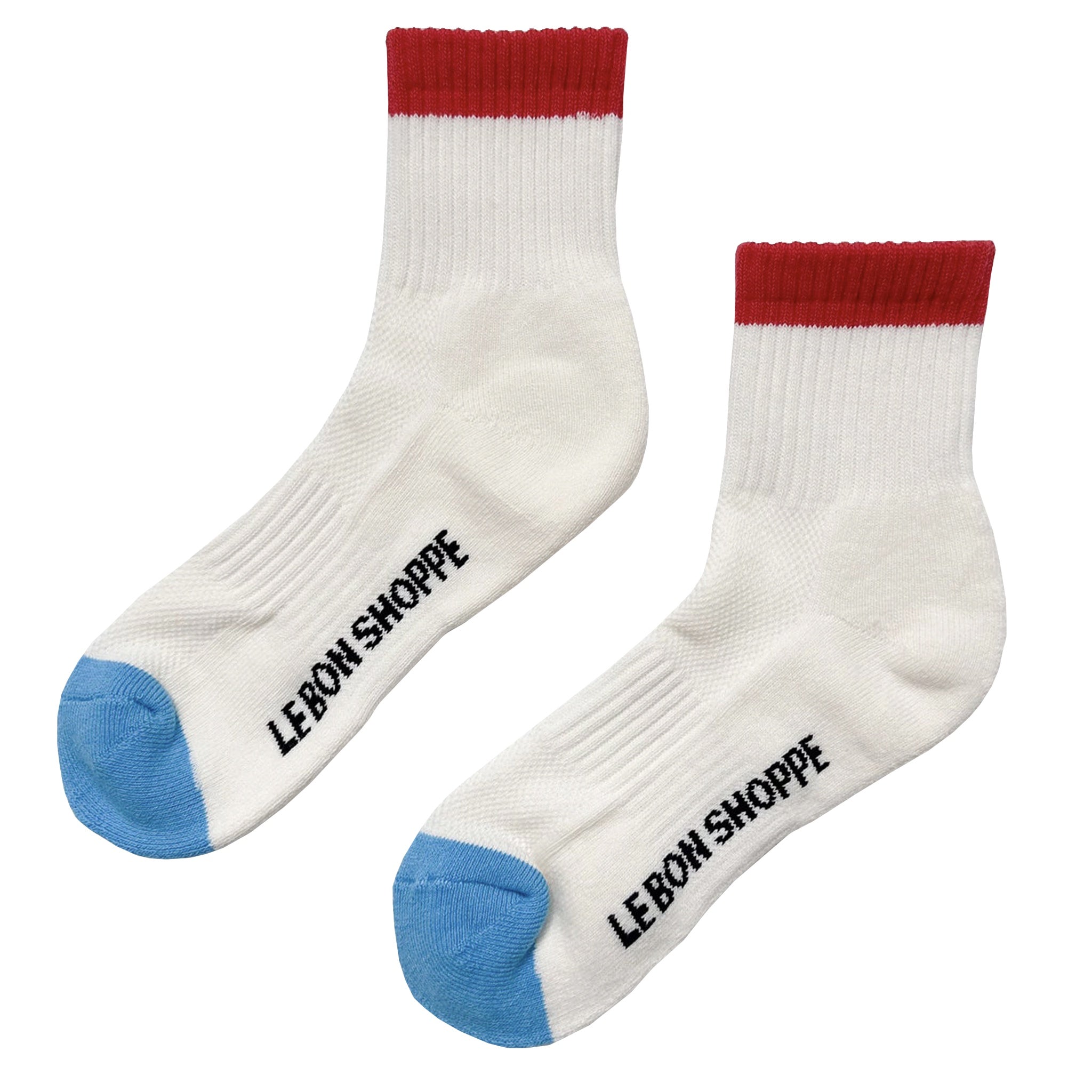 White socks with red tops and blue toes, featuring 'LE BON SHOPPE' branding.