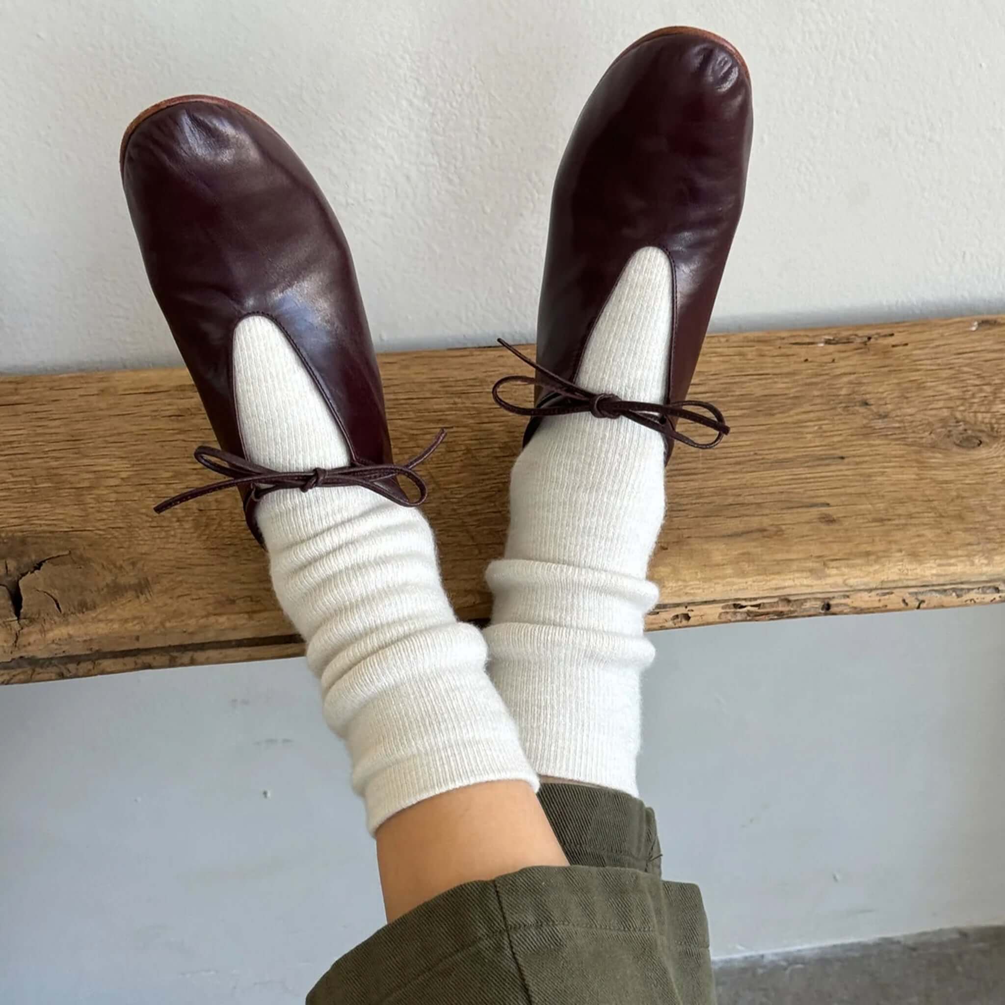 Le Bon Shoppe Camper Socks - Oatmeal styled with chic brown shoes on a wooden surface.