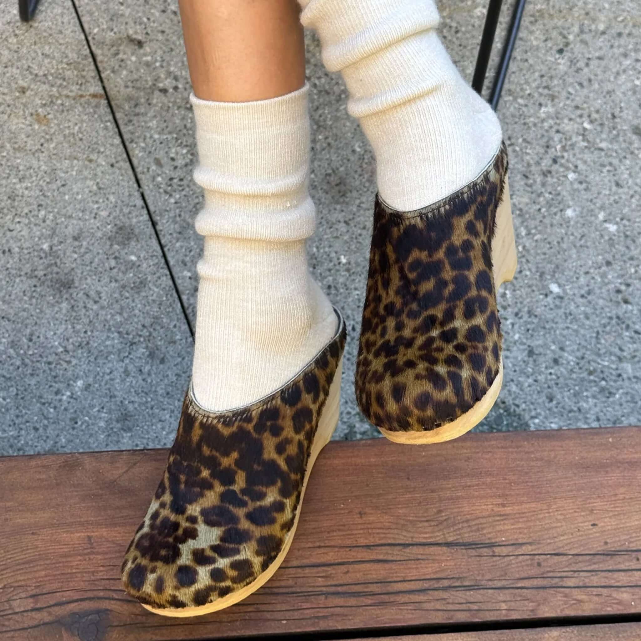 Le Bon Shoppe Camper Socks - Oatmeal worn with stylish leopard print clogs, showcasing cozy and chic footwear.
