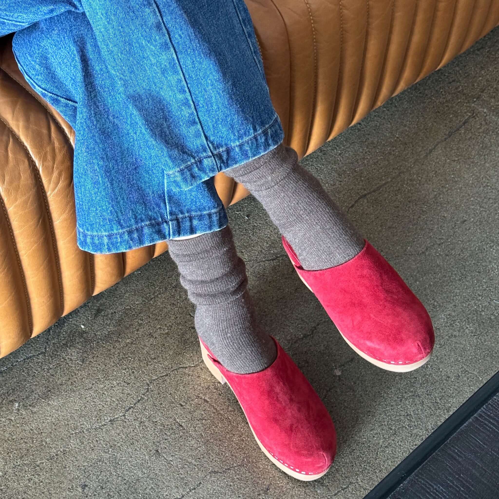 Person wearing Le Bon Shoppe Camper Socks - Wood with red clogs and denim, showcasing comfort and style.