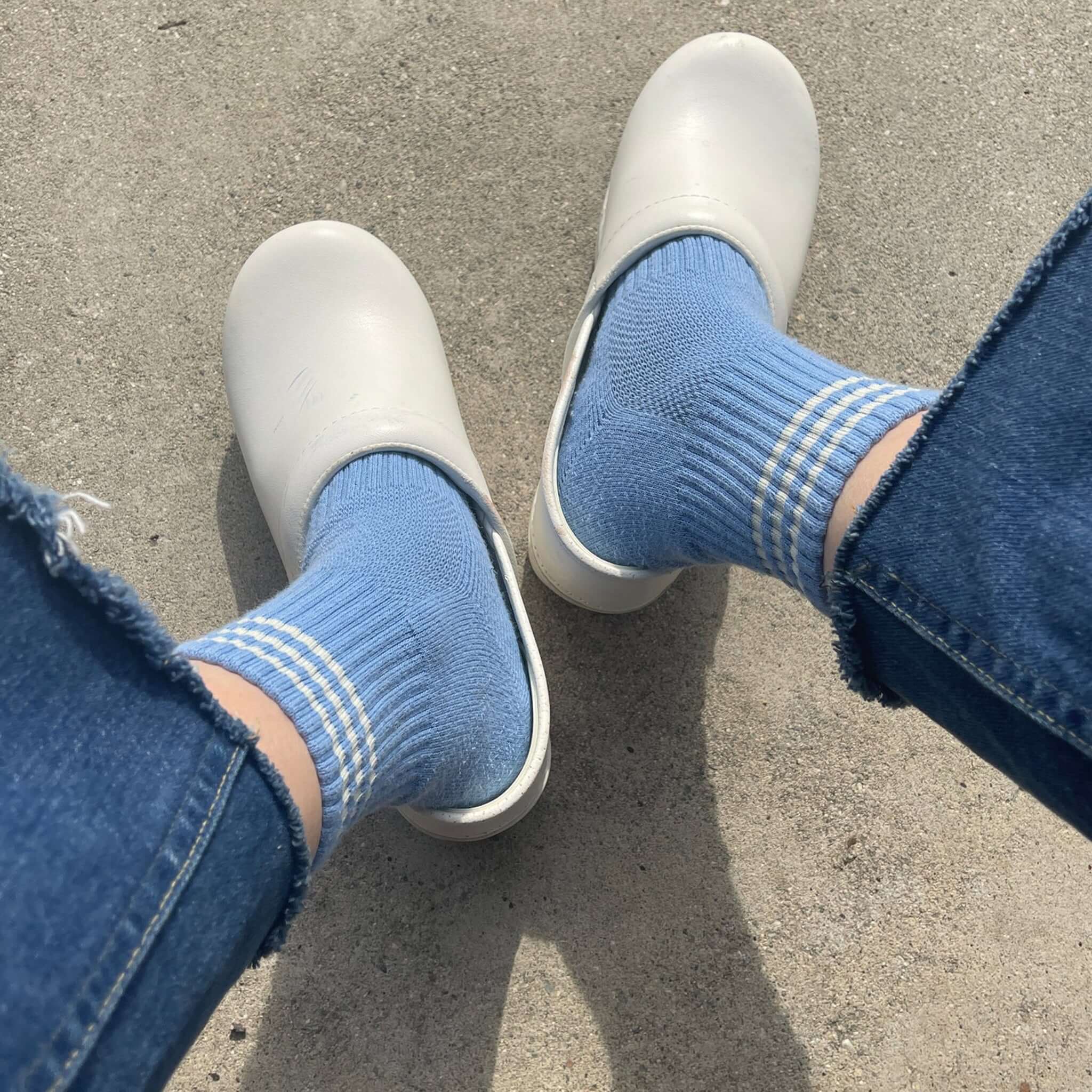 Le Bon Shoppe Girlfriend Socks - Parisian Blue styled with casual clogs, showcasing a triple contrast stripe.