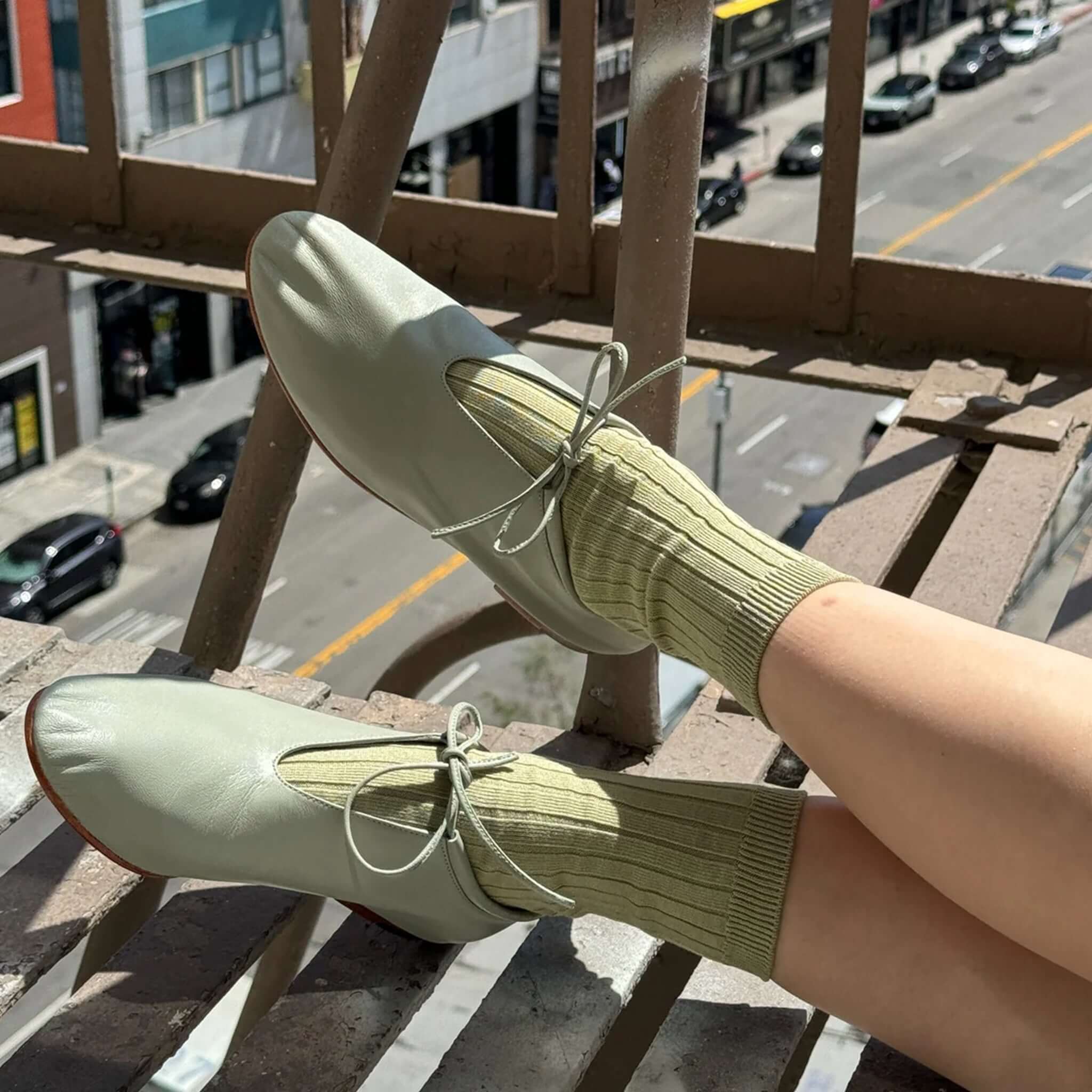 Le Bon Shoppe Her Cotton Socks - Avocado styled with green shoes on a sunny day.