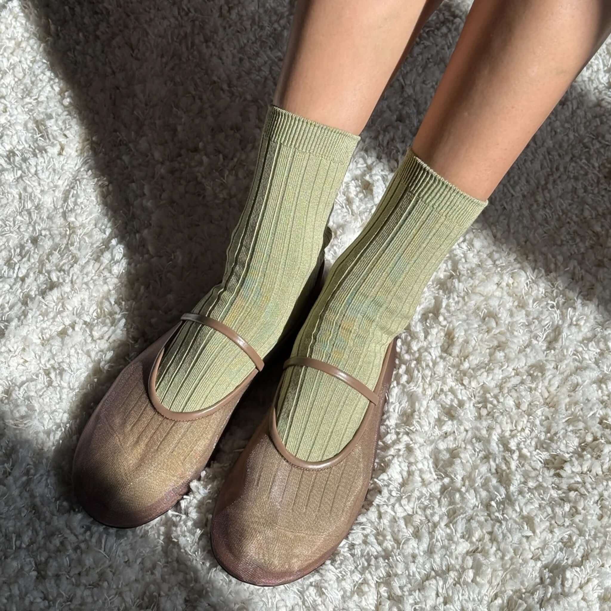 Le Bon Shoppe Her Cotton Socks - Avocado worn with stylish flats on a cozy carpet.