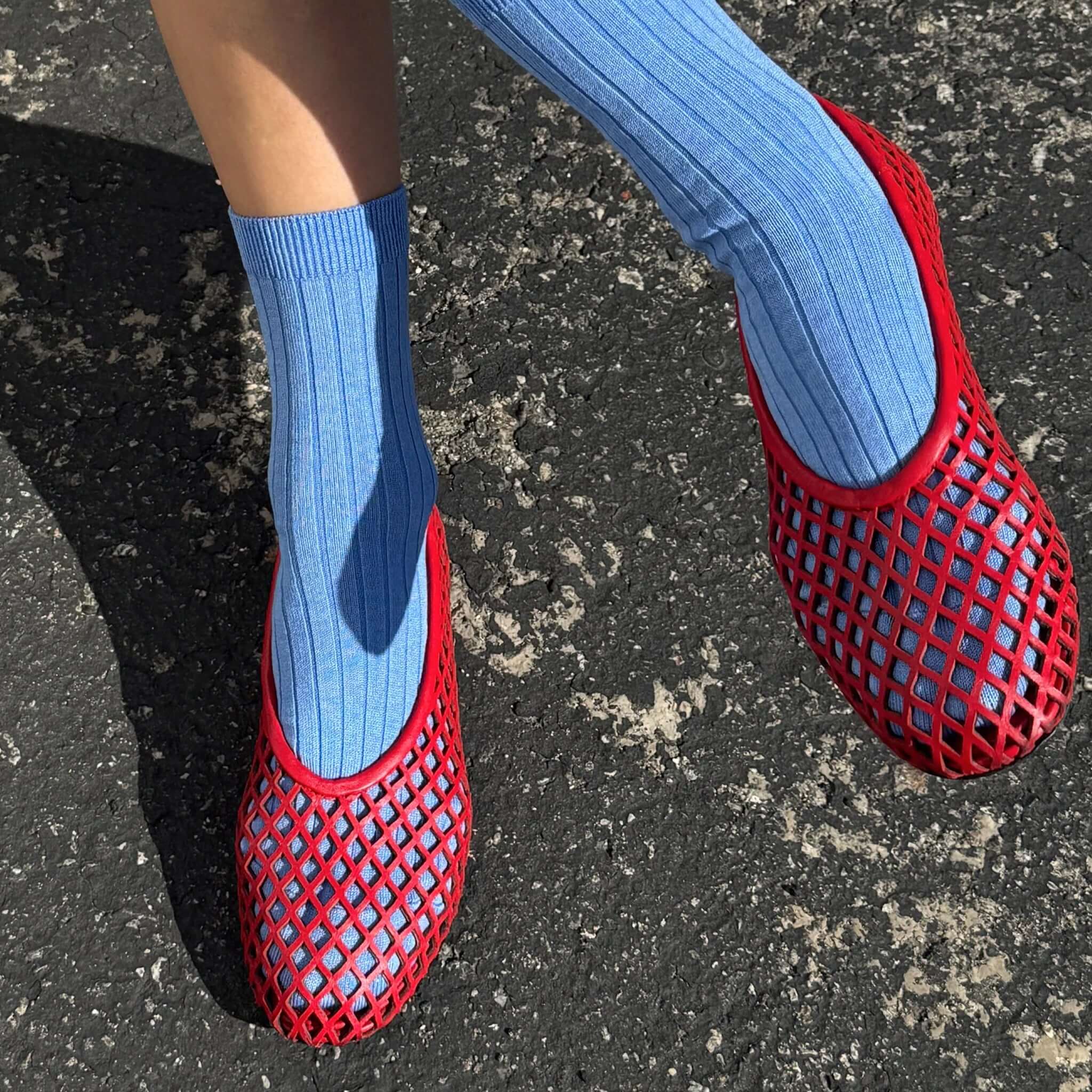 Le Bon Shoppe Her Socks - Periwinkle styled with red mesh shoes on a textured surface.