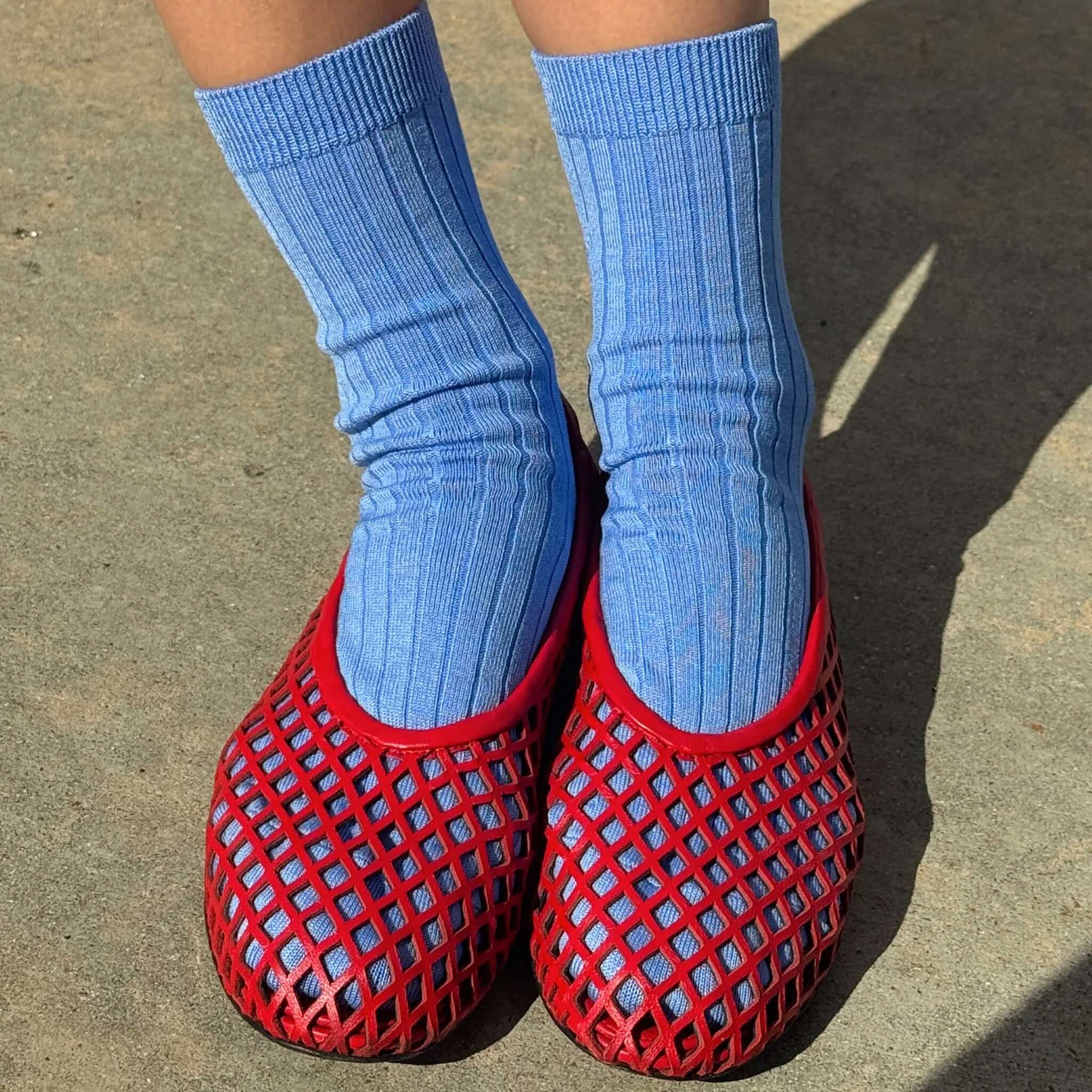 Le Bon Shoppe Her Socks - Periwinkle worn with red mesh shoes on outdoor surface.