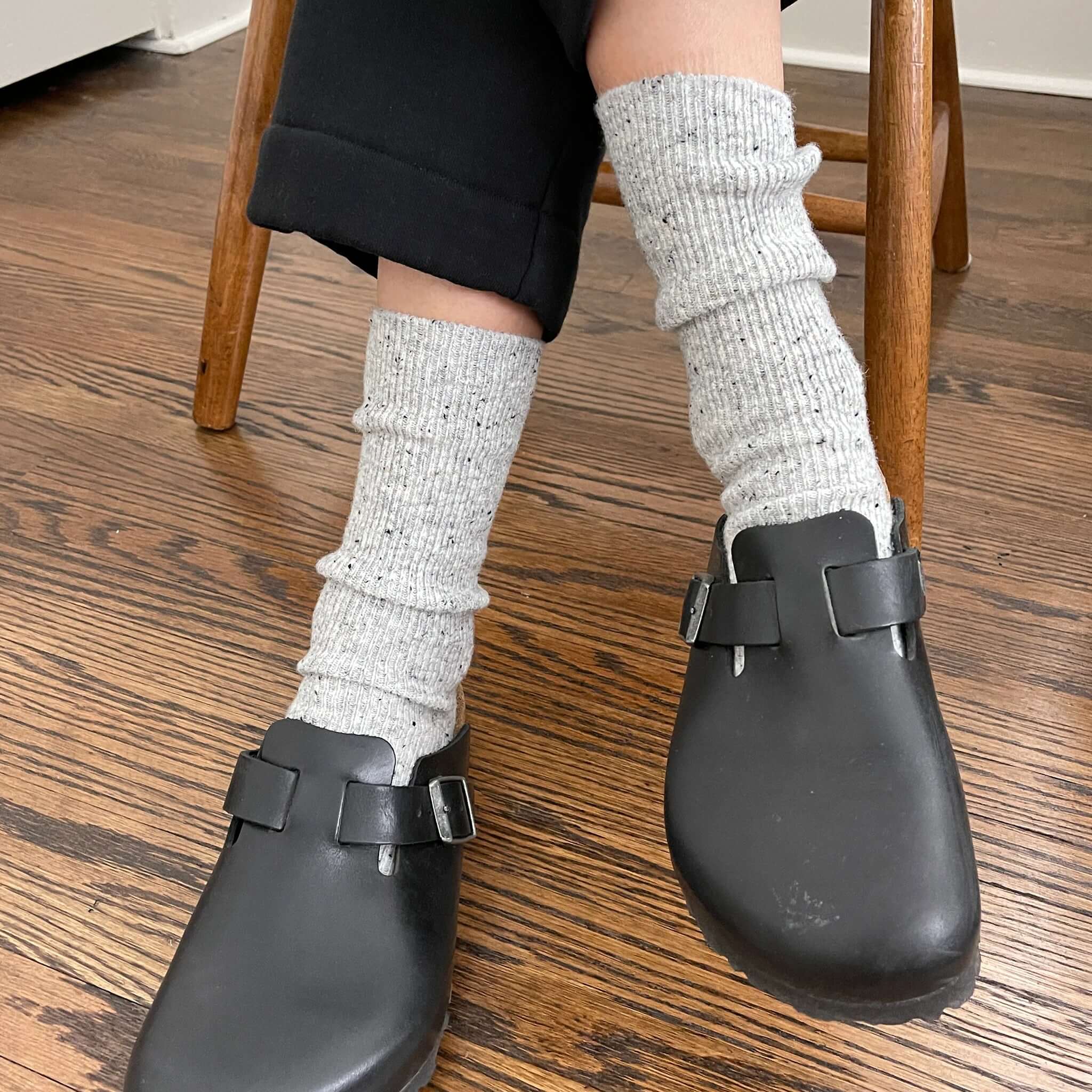 Le Bon Shoppe Snow Socks - Cookies & Cream styled with black clogs on wooden floor.