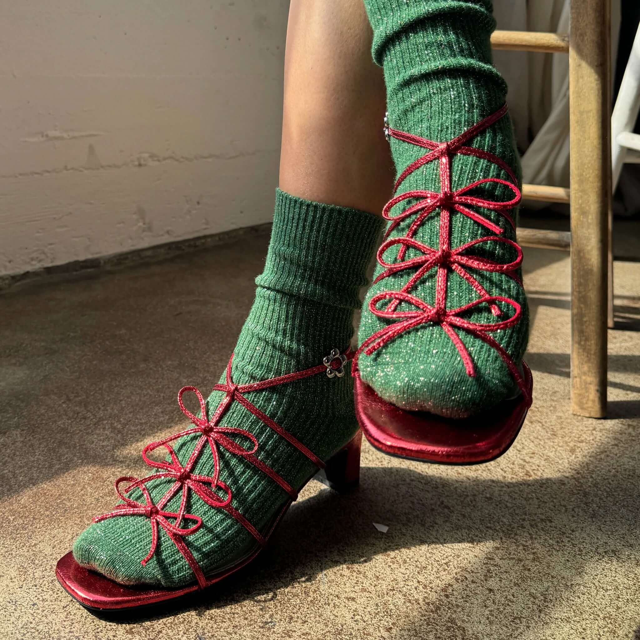 Le Bon Shoppe Winter Sparkle Socks - Evergreen styled with red heels, showcasing a cozy look perfect for winter.