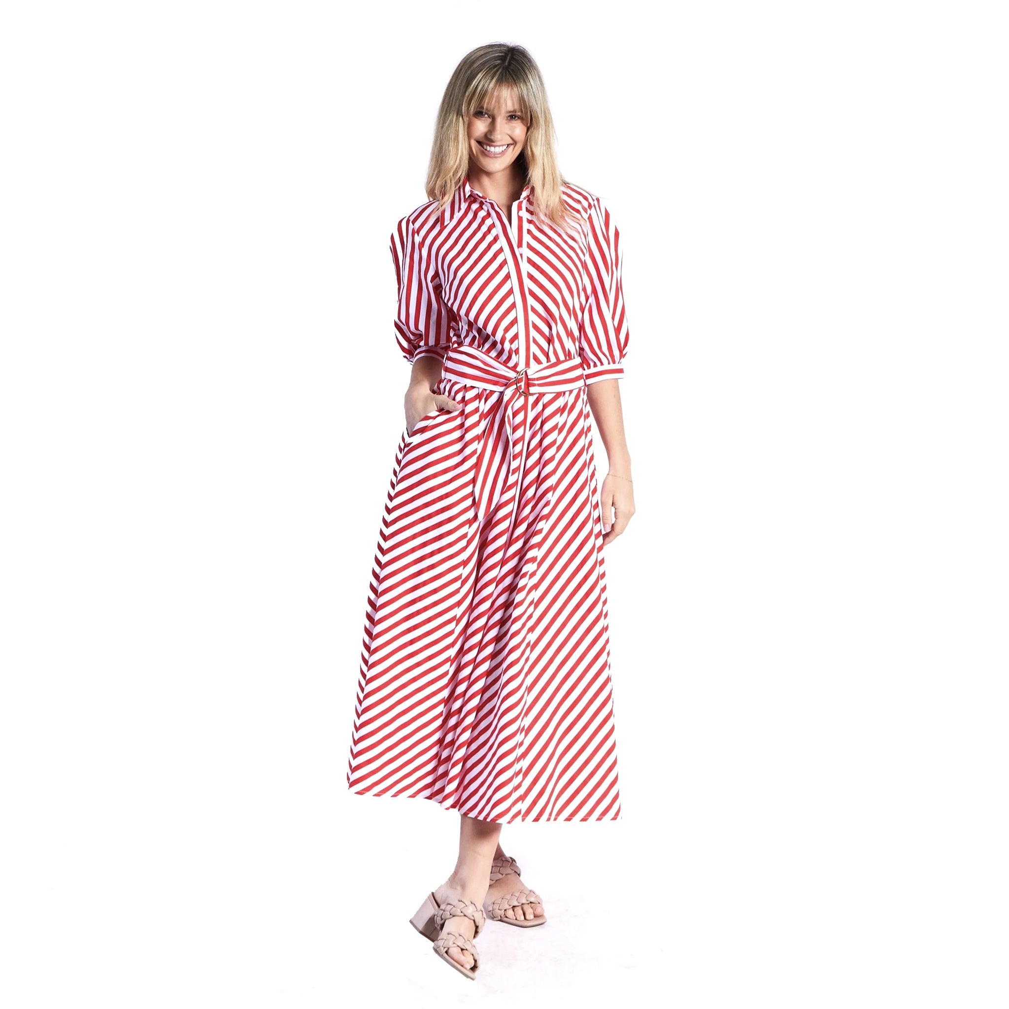 Woman wearing a red and white striped dress on a white background