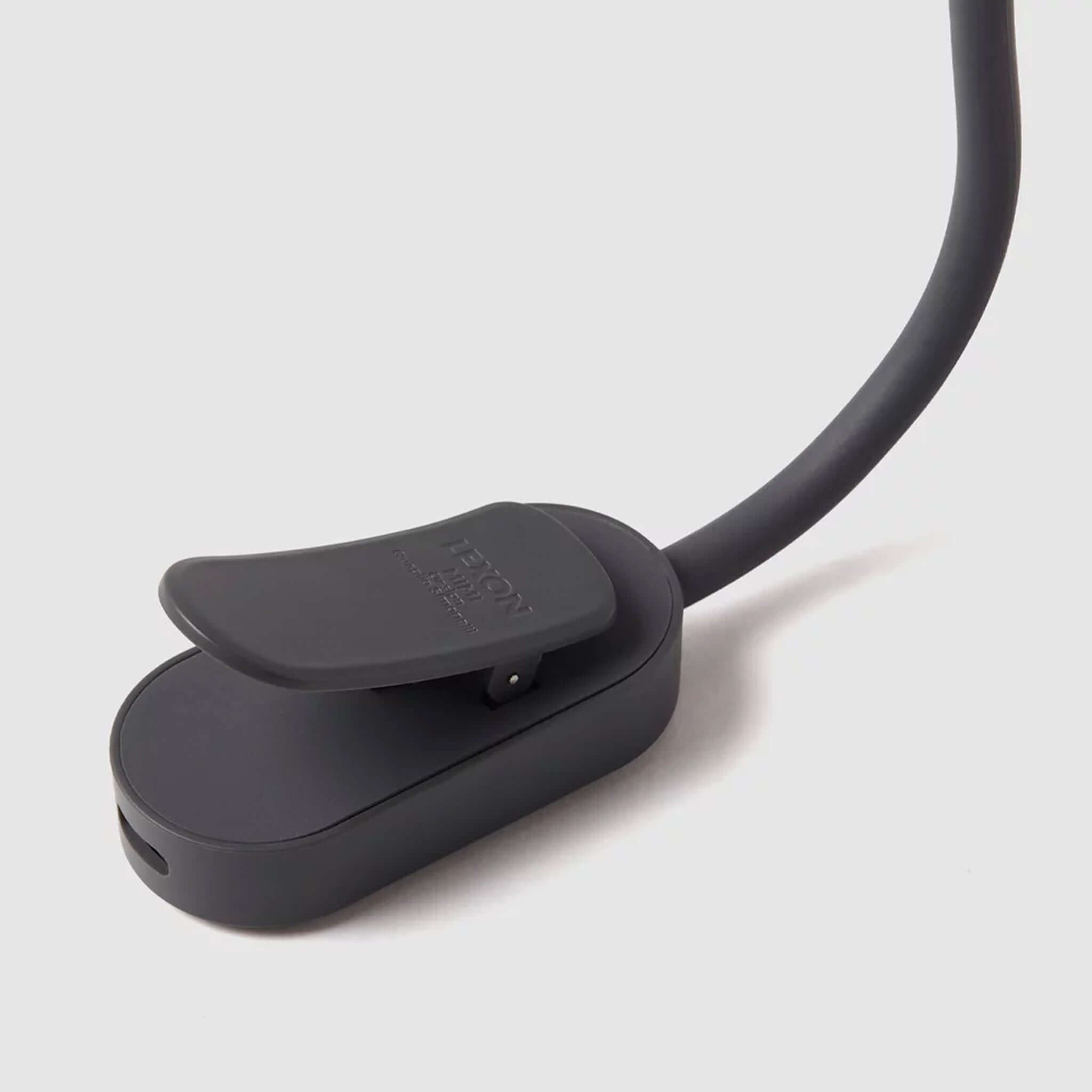 Lexon Mimi Clip-on Reading Lamp - Gunmetal close-up view of the clip and base, showcasing its sleek design.
