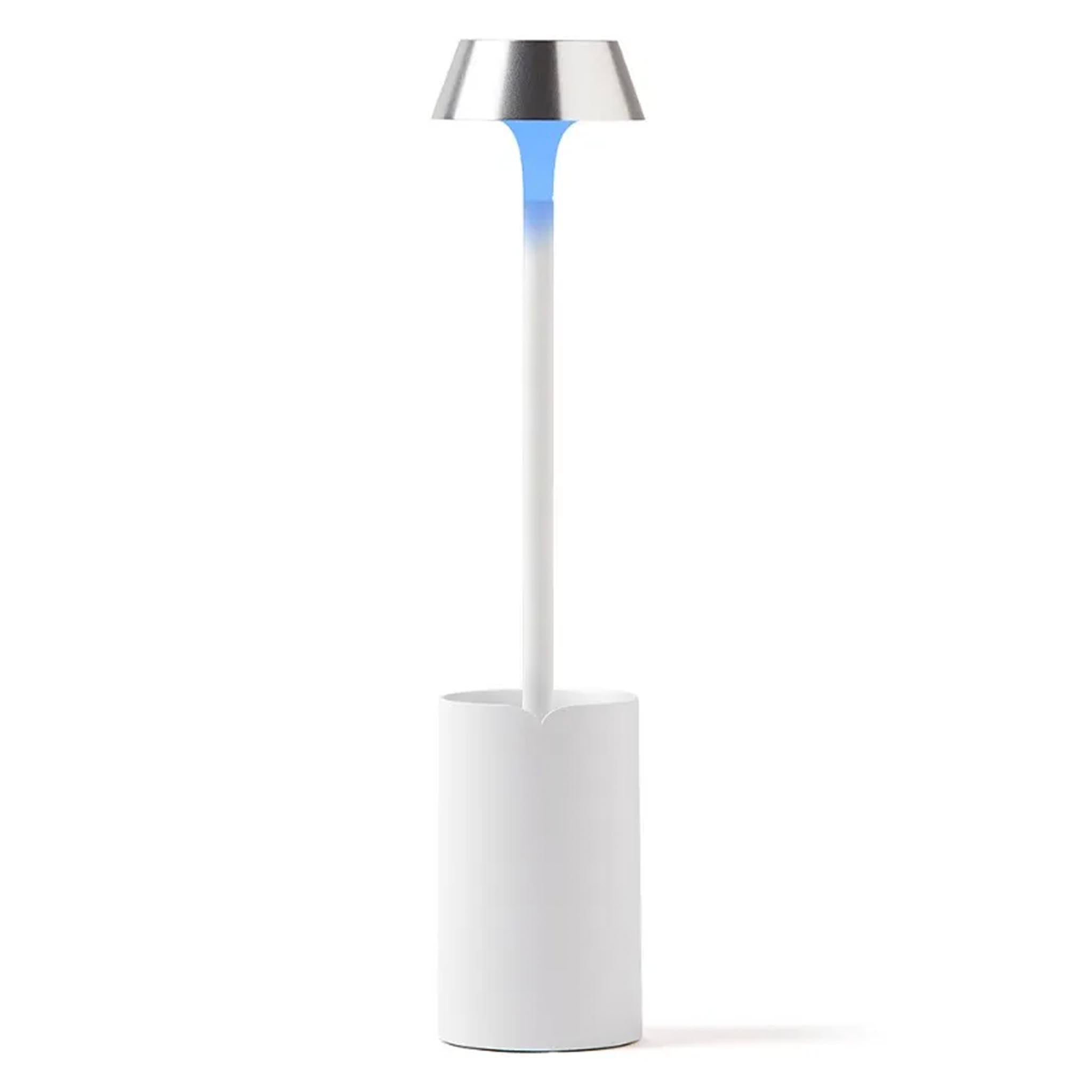 White lamp with a silver top on a white background