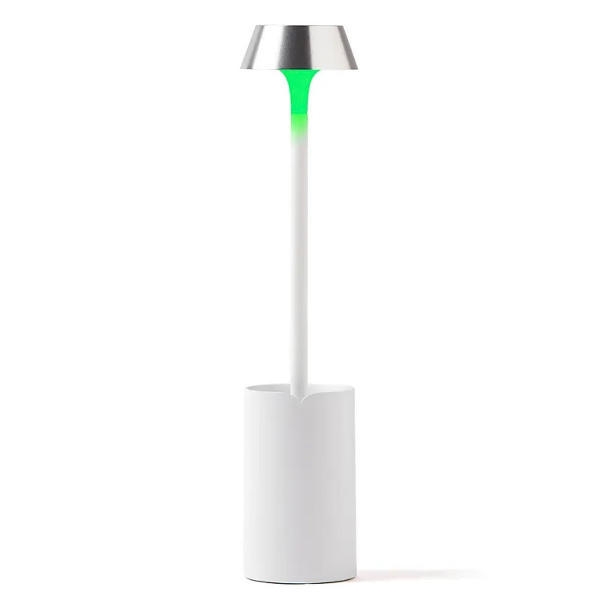 White lamp with a green light on a white background