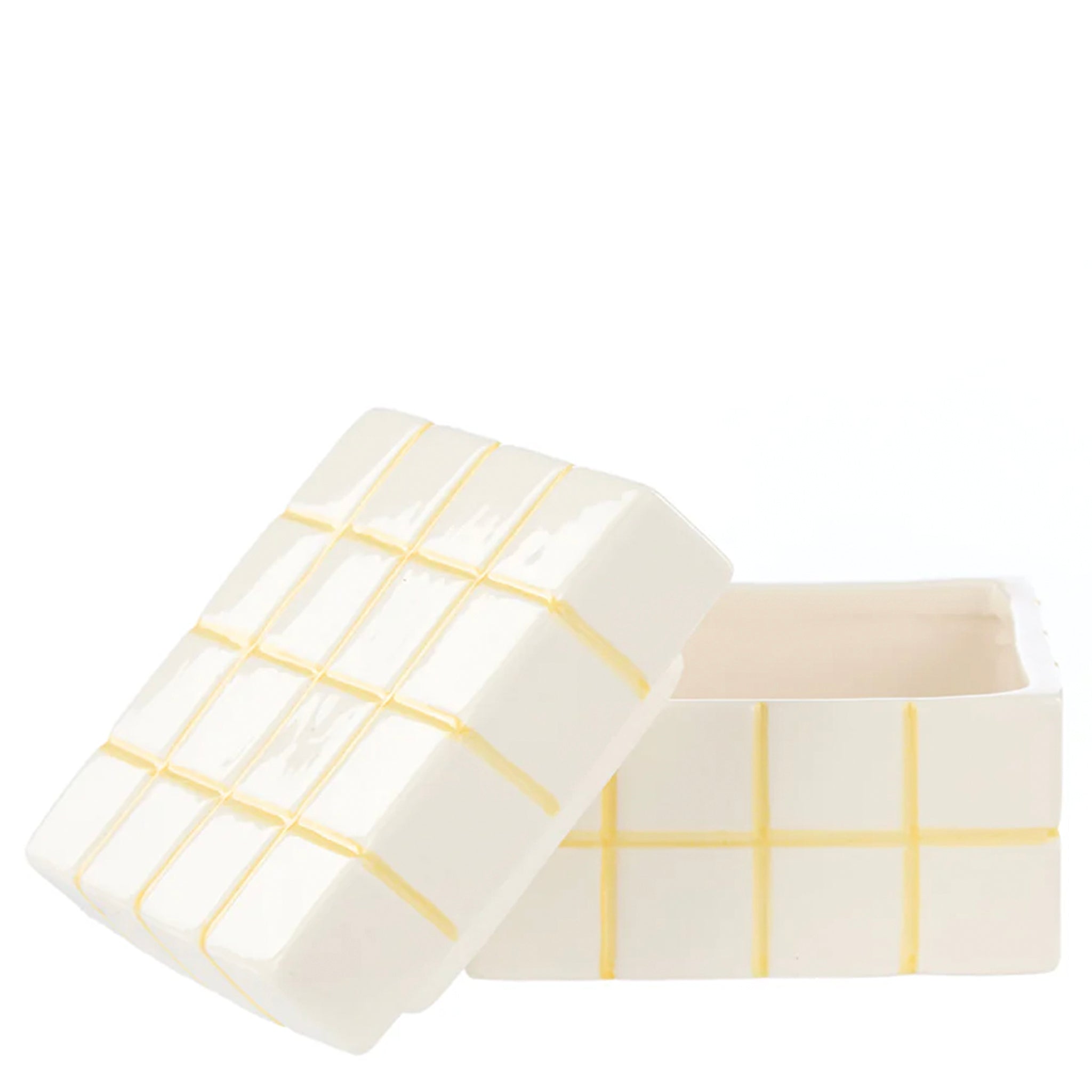 Two white containers with yellow grid patterns on a white background