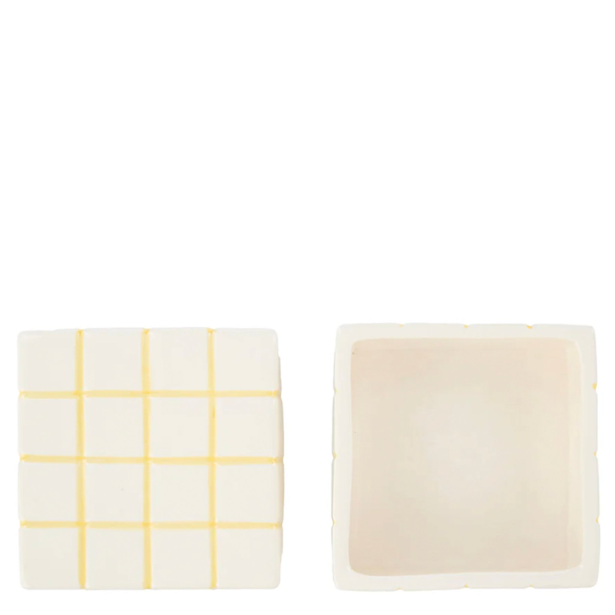 Two rectangular items, one with a yellow grid pattern and the other plain beige, on a white background.