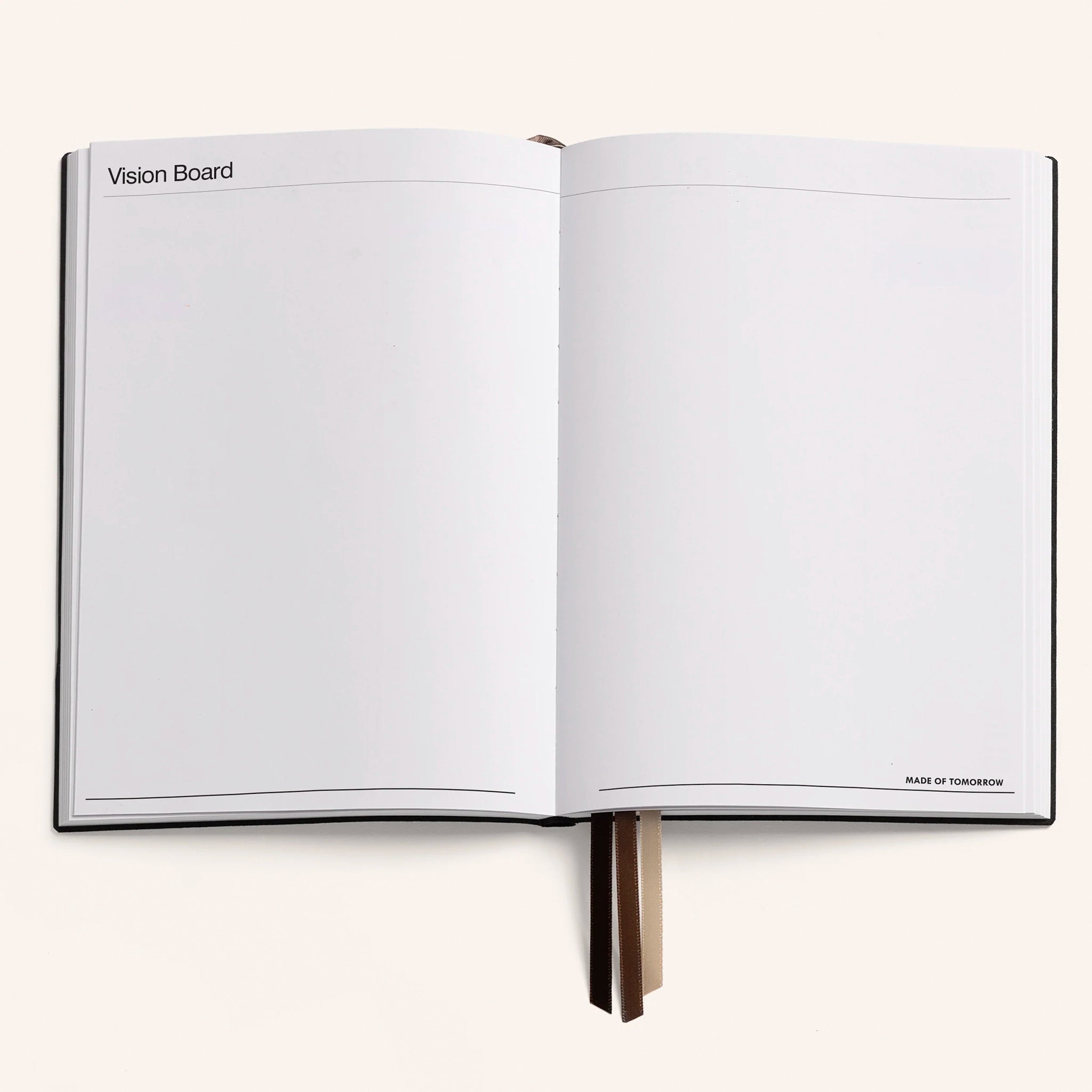 Open notebook with 'Vision Board' on a white background