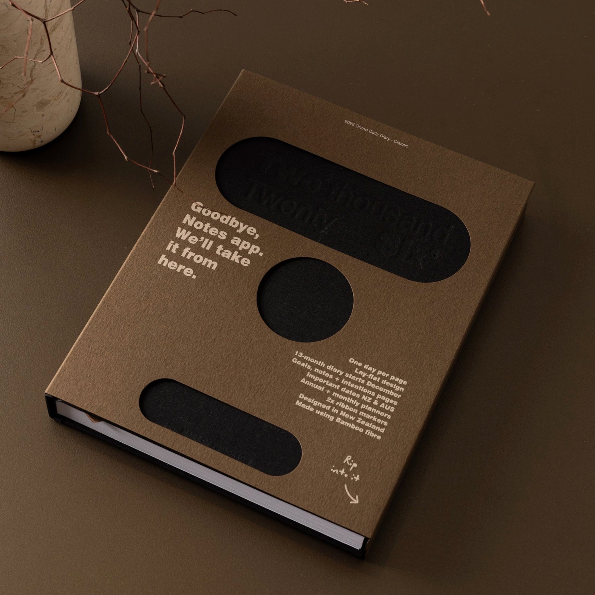 Brown book with text on a brown surface