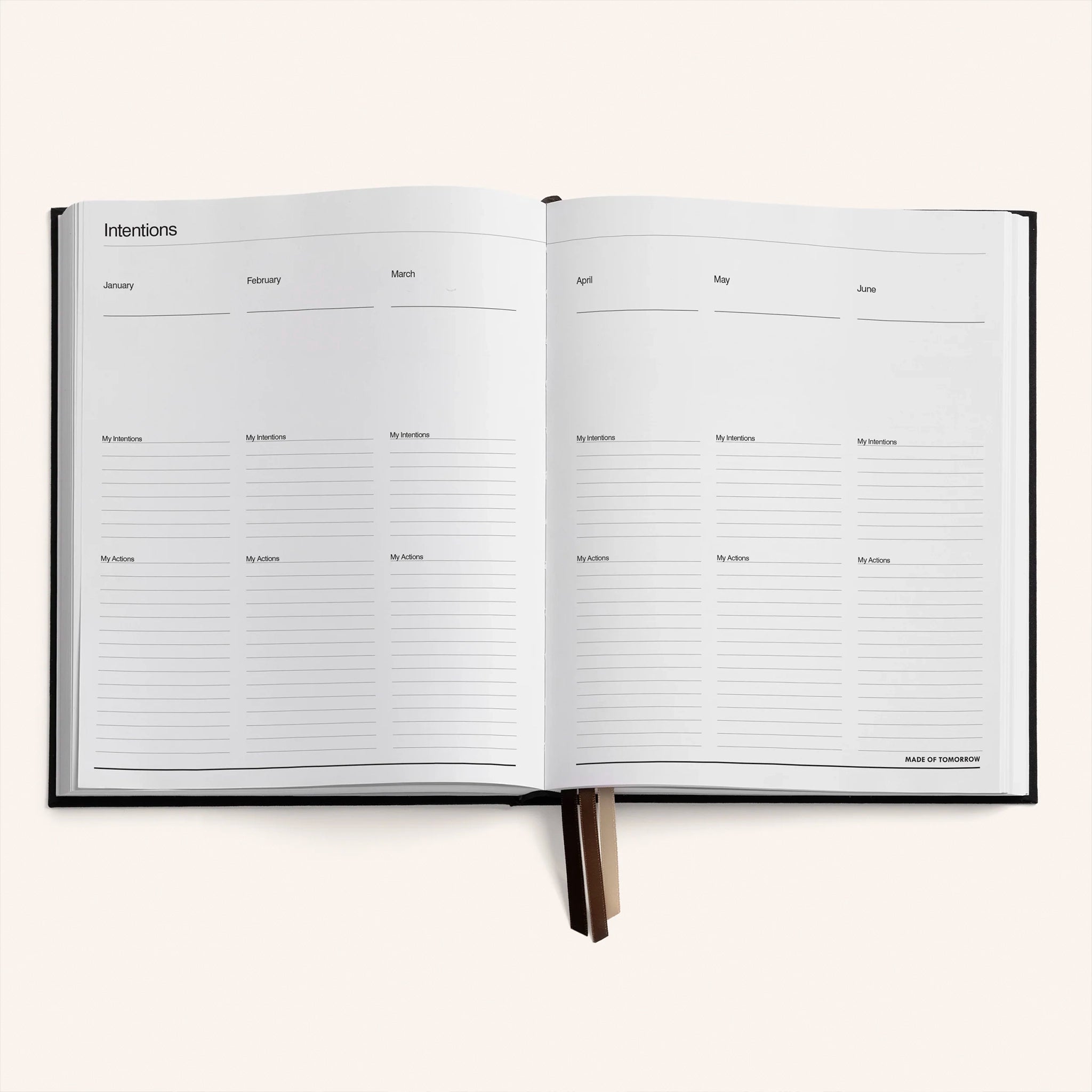 Open planner with monthly layout on a white background