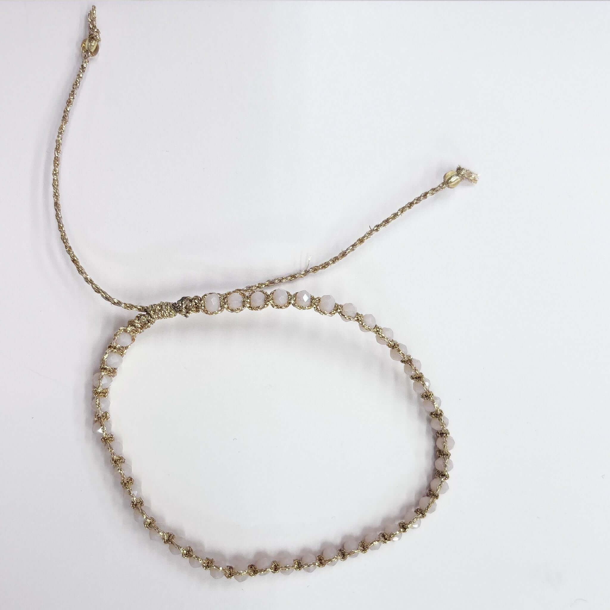 Margaret Adeline Bracelet featuring delicate faceted crystals on fine gold thread with adjustable closure.