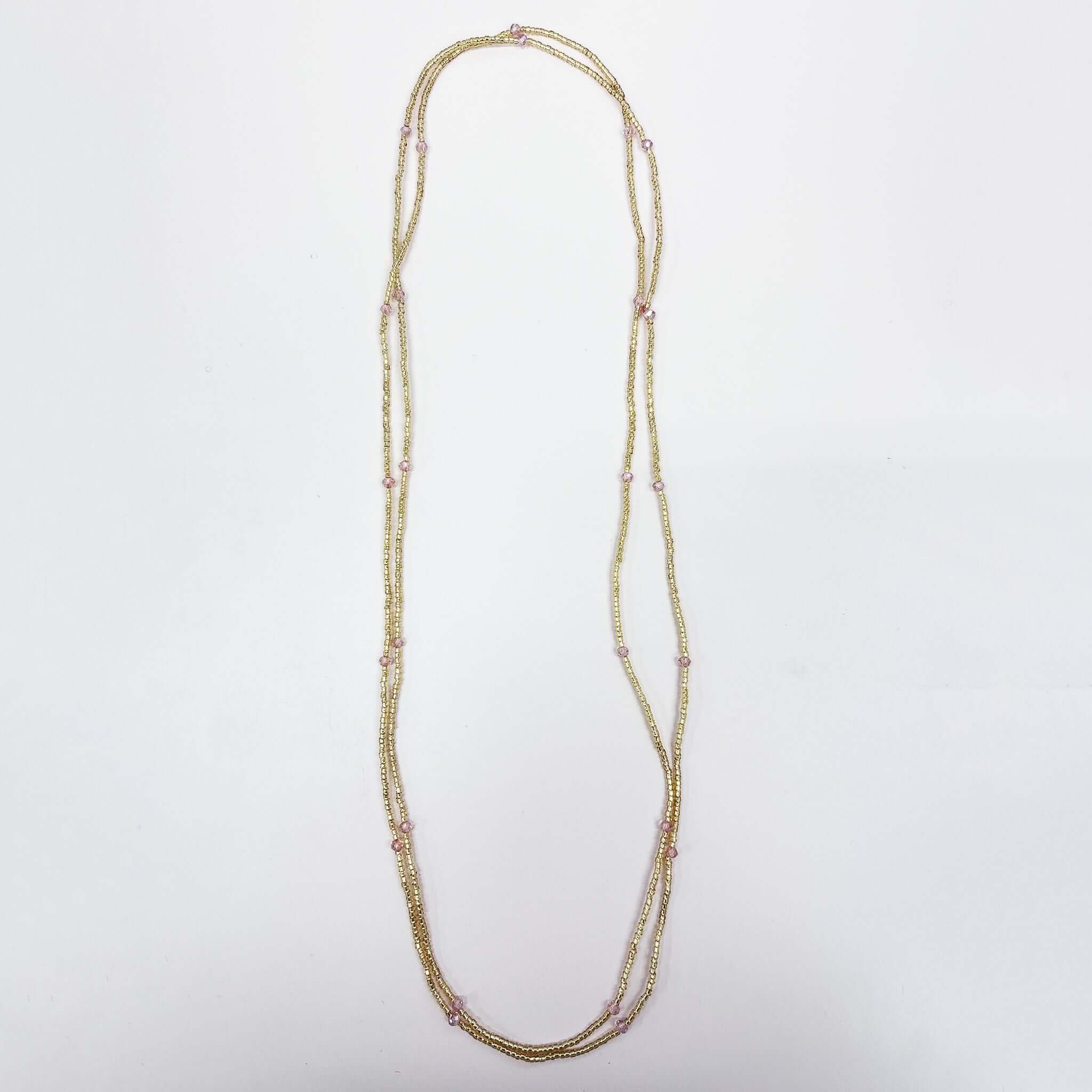 Margaret Dorothy Necklace featuring gold seed beads and faceted accent beads, styled for versatile wear.
