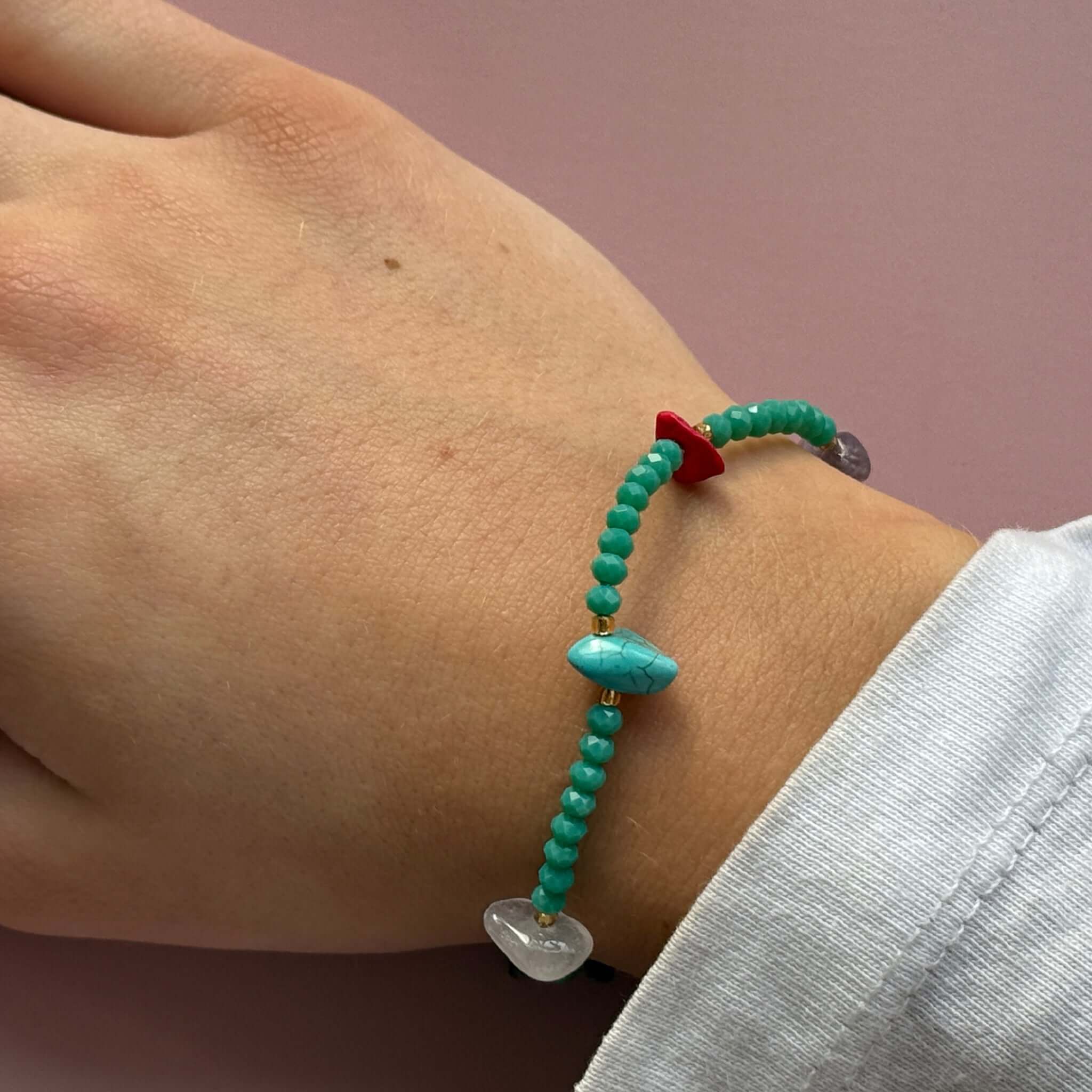 Margaret Cora Bracelet featuring turquoise seed beads and raw crystal chips, showcased on a wrist.