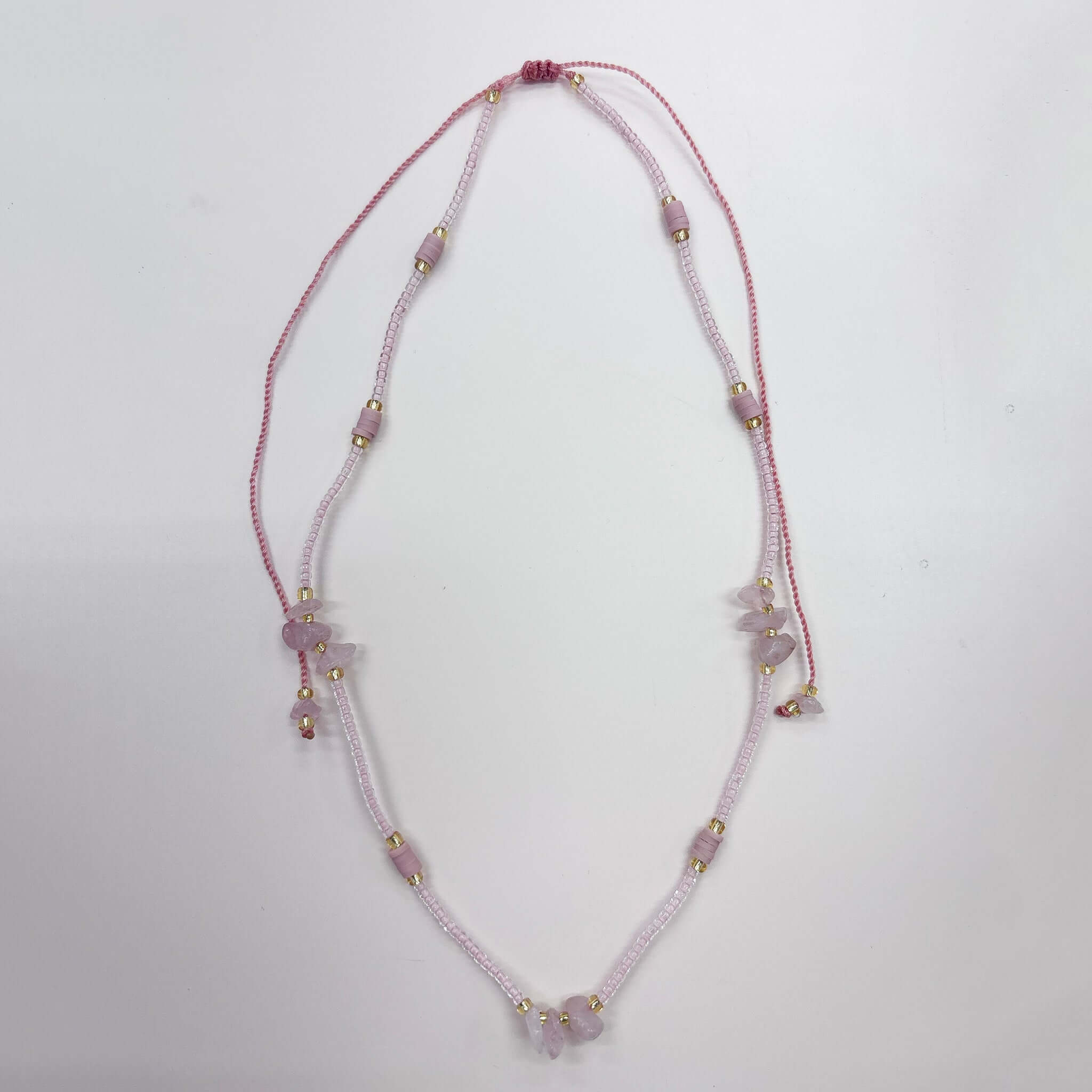 Margaret Cora Necklace featuring seed beads, raw stone accents, and gold spacers for a colorful summer accessory.