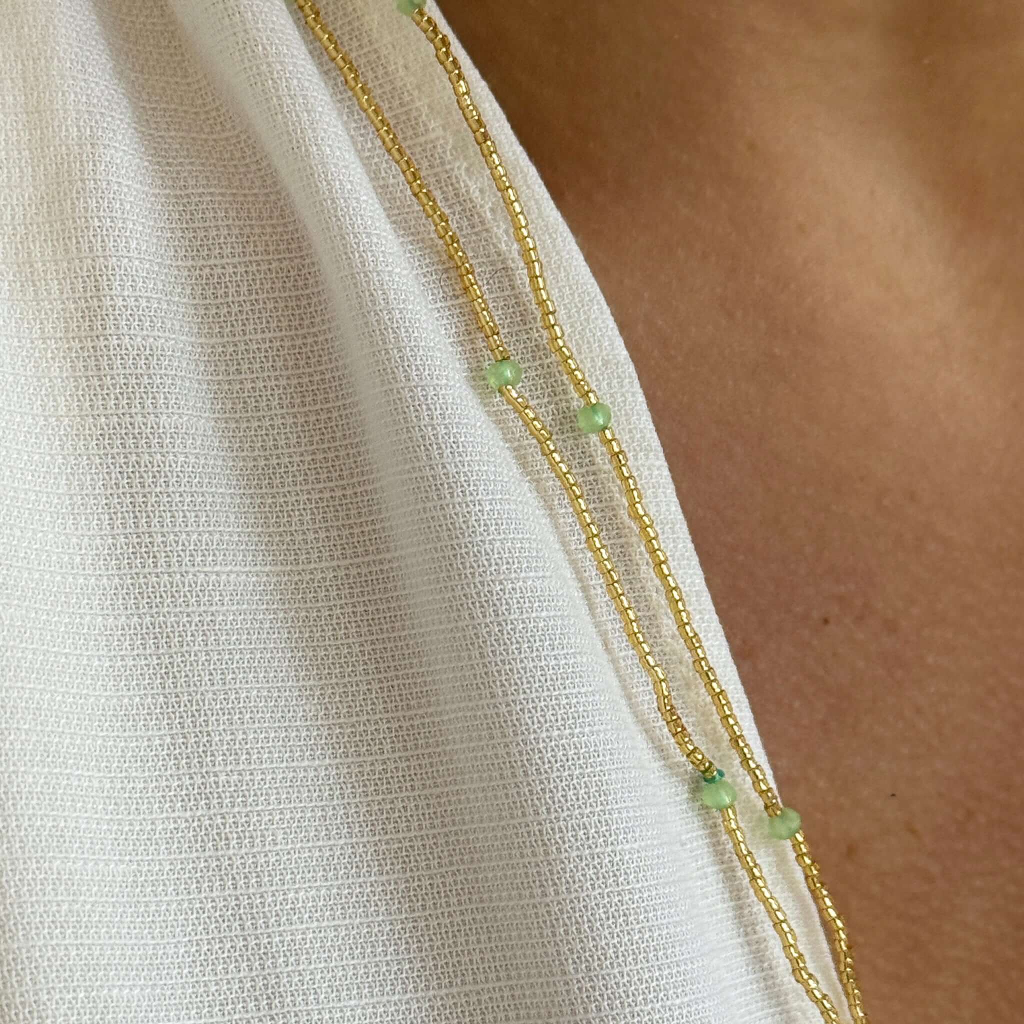 Close-up of the Margaret Dorothy Necklace featuring gold seed beads and delicate accent beads.