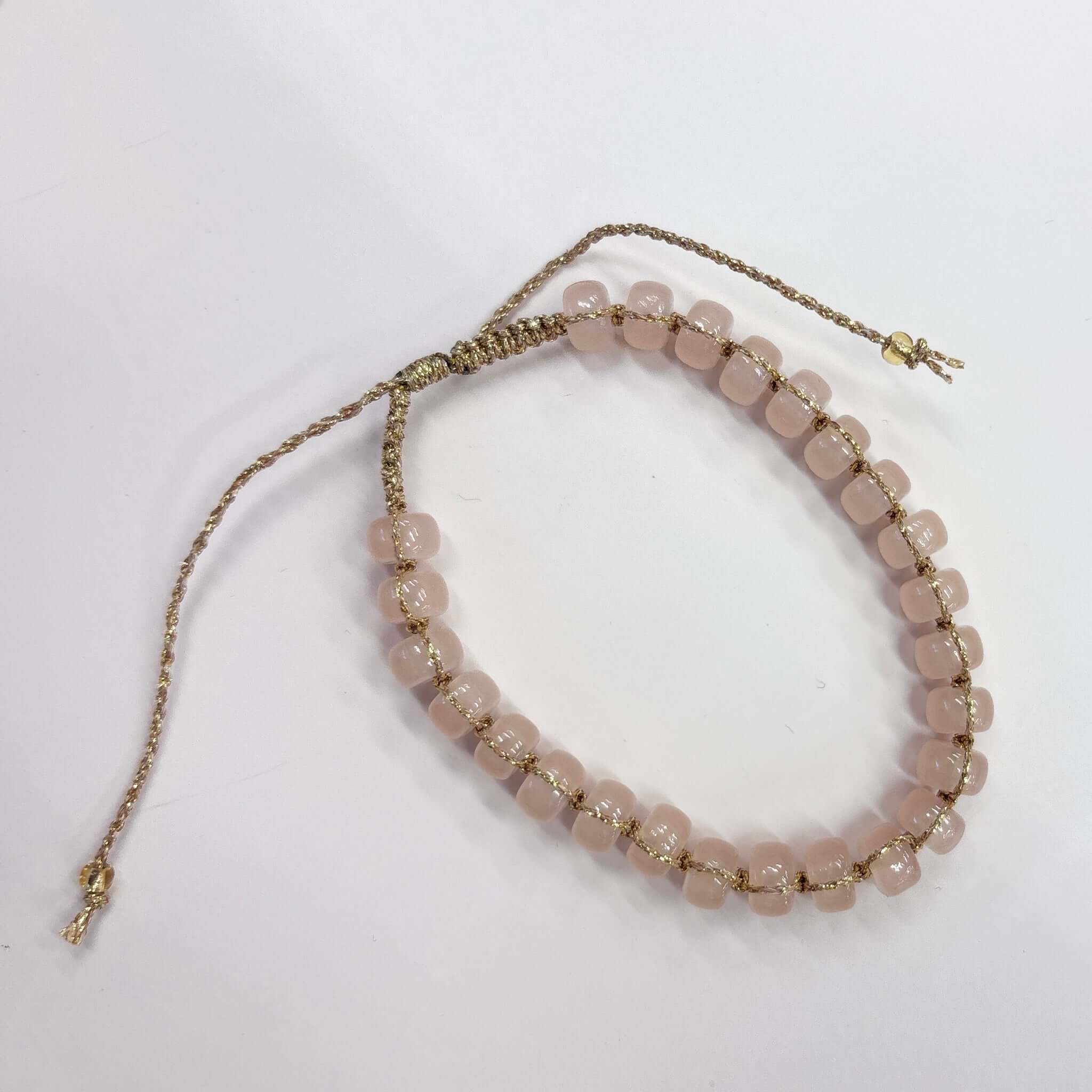Margaret Edna Bracelet featuring chunky beads on a fine gold cord with adjustable closure, perfect for stacking.
