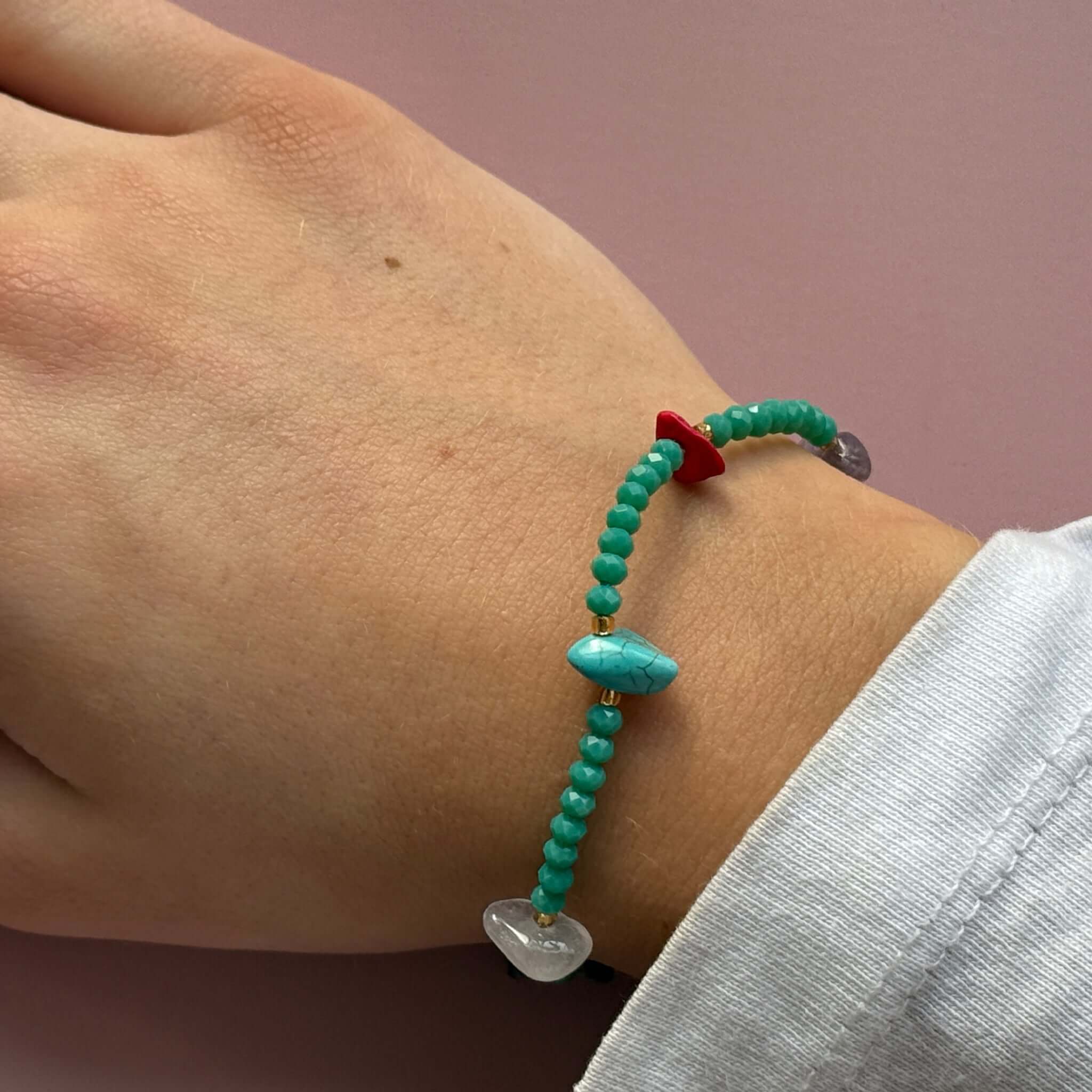 Margaret Lucille Bracelet featuring turquoise, red agate, and clear quartz beads on a wrist.