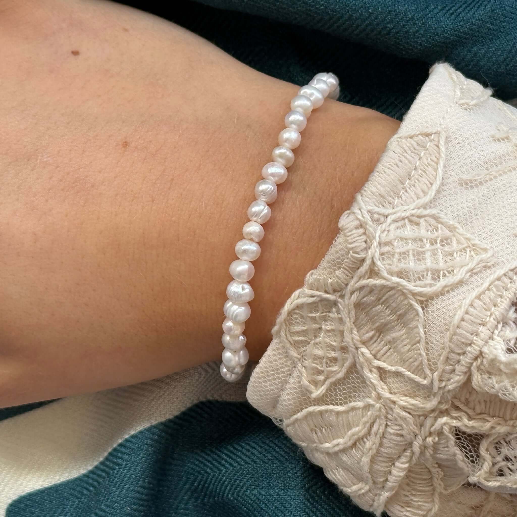 Margaret Pearl Bracelet featuring a full strand of unique baroque freshwater pearls on a wrist.