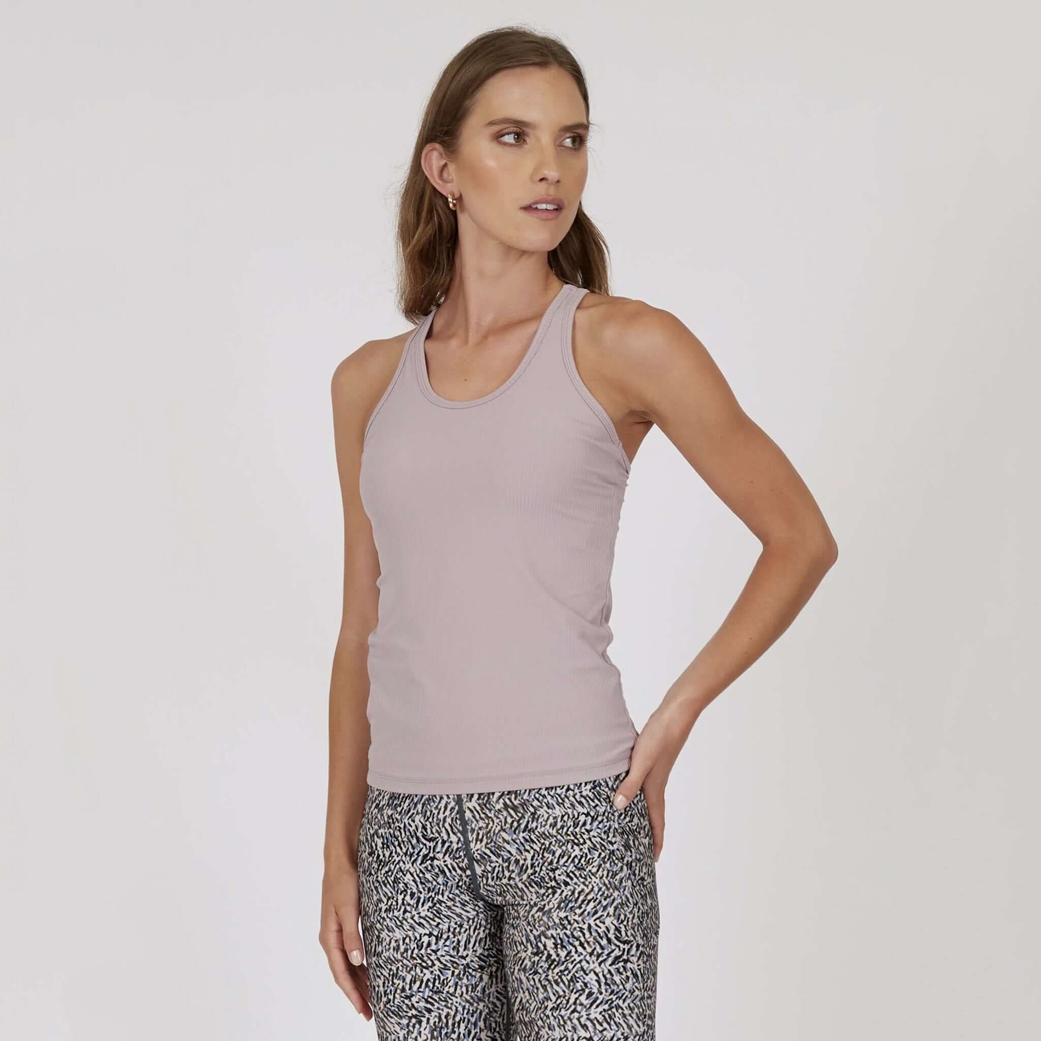 Marlow Contour Air Tank - Rose Beige worn with patterned leggings, showcasing a sleek design and comfortable fit.
