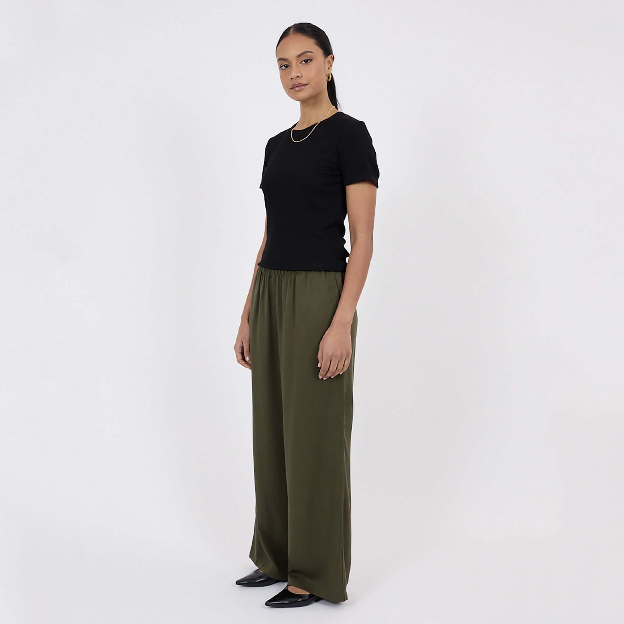 Marlow Eclipse Wide Leg Pants - Spruce displayed on a model, showcasing the fluid drape and elastic waistband.