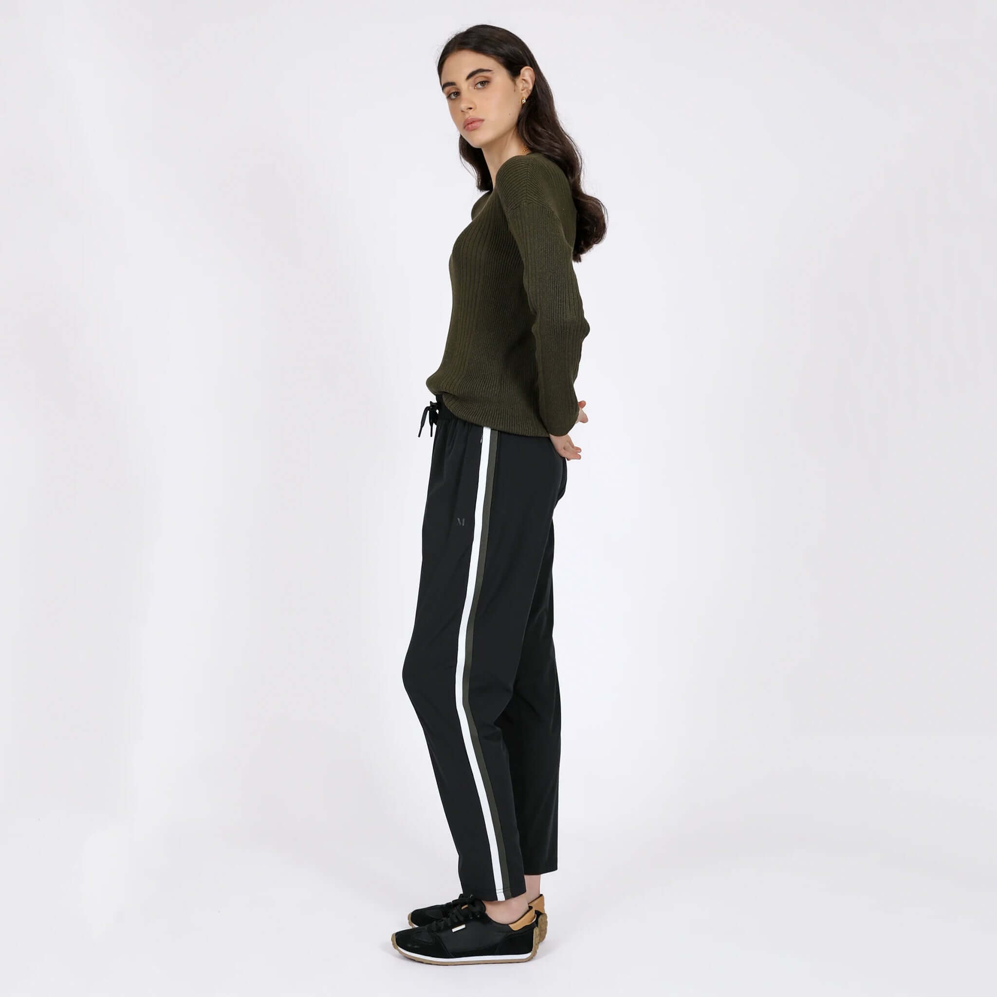 Alt Tag: Marlow Transit Pants - Black on model, featherlight stretch quick-dry wrinkle-resistant travel pants with side stripe