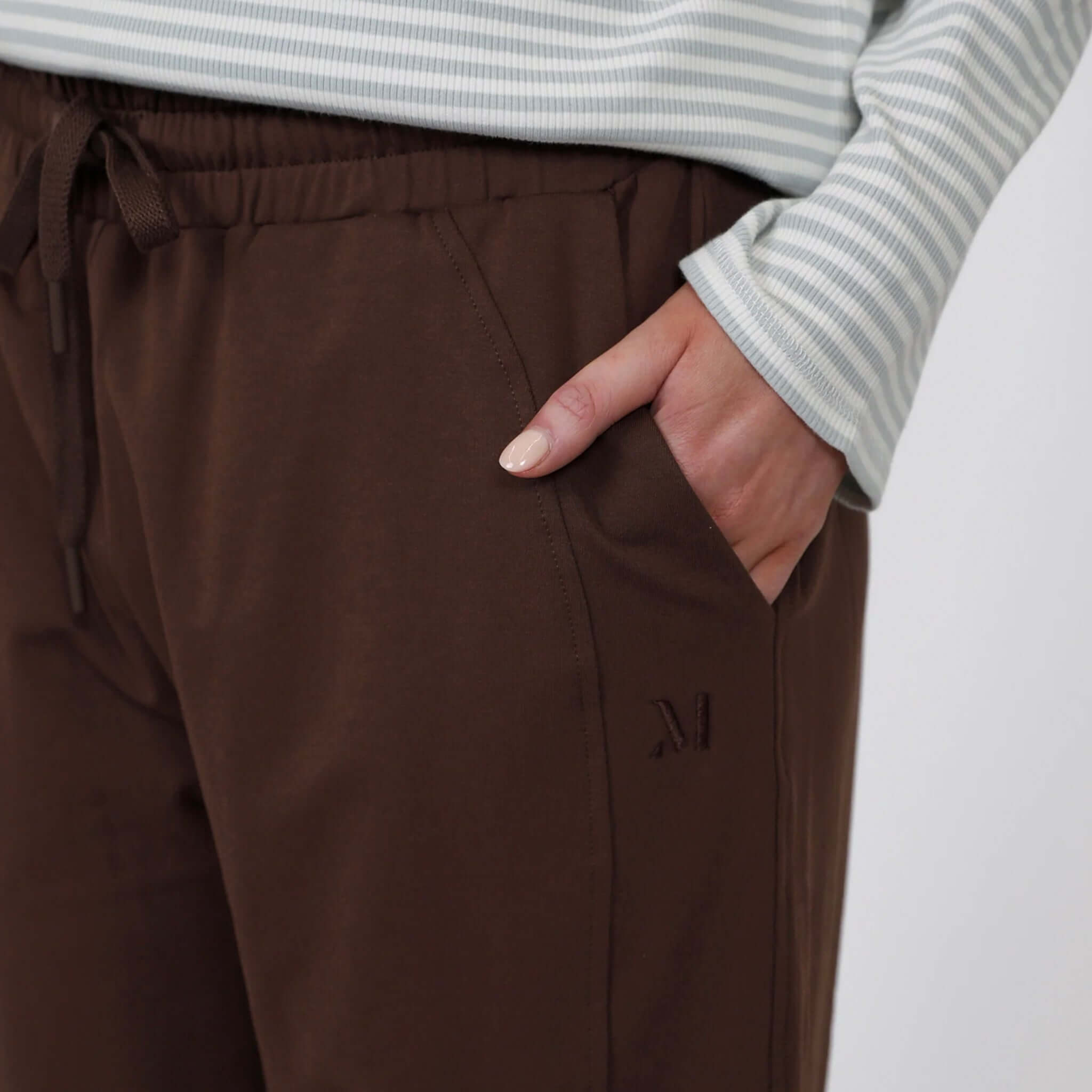Close-up of the Marlow Barrel Trackie - Java, showcasing comfortable side pockets and waistband.