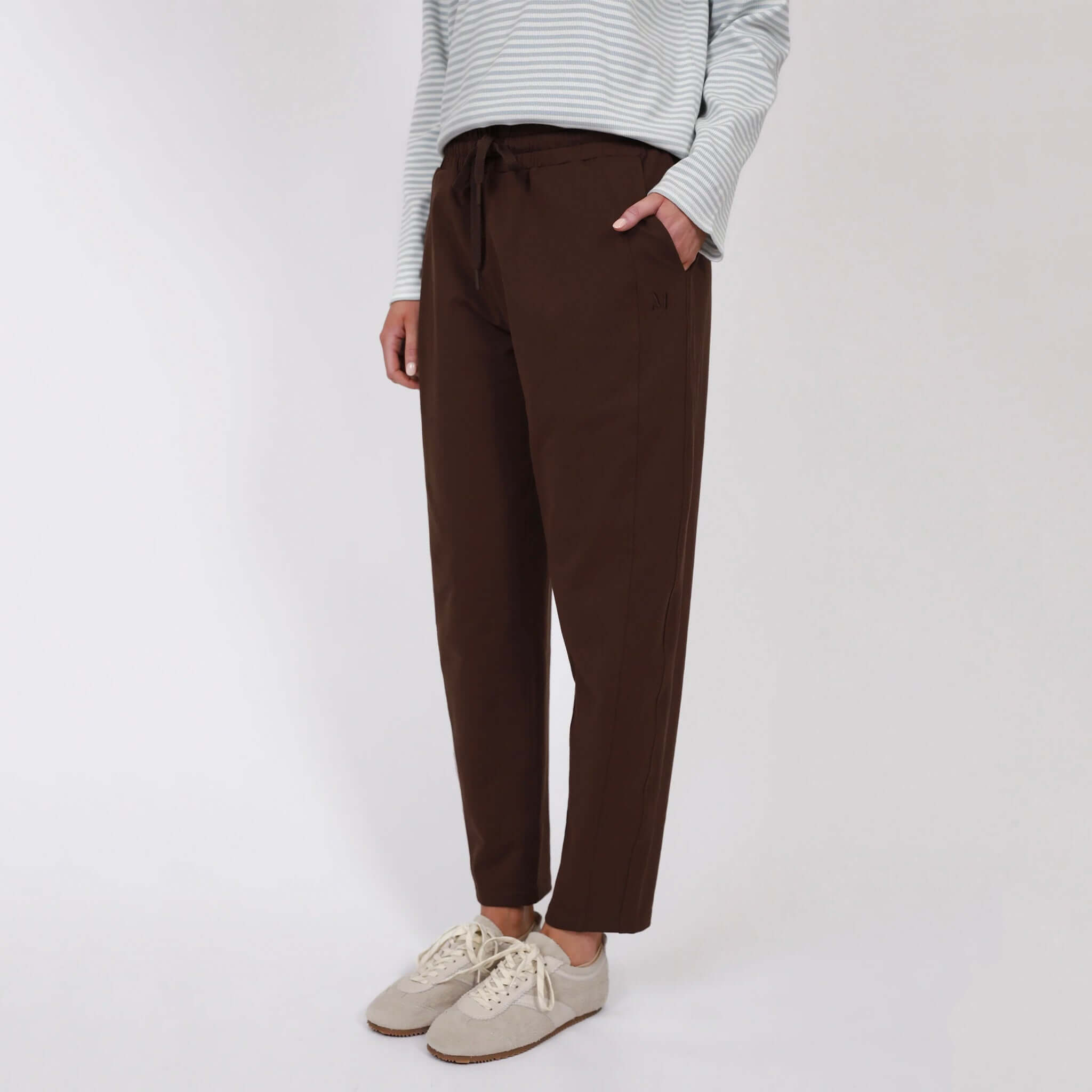 Marlow Barrel Trackie - Java worn by a model standing with hands in pockets, showcasing relaxed barrel-leg style.