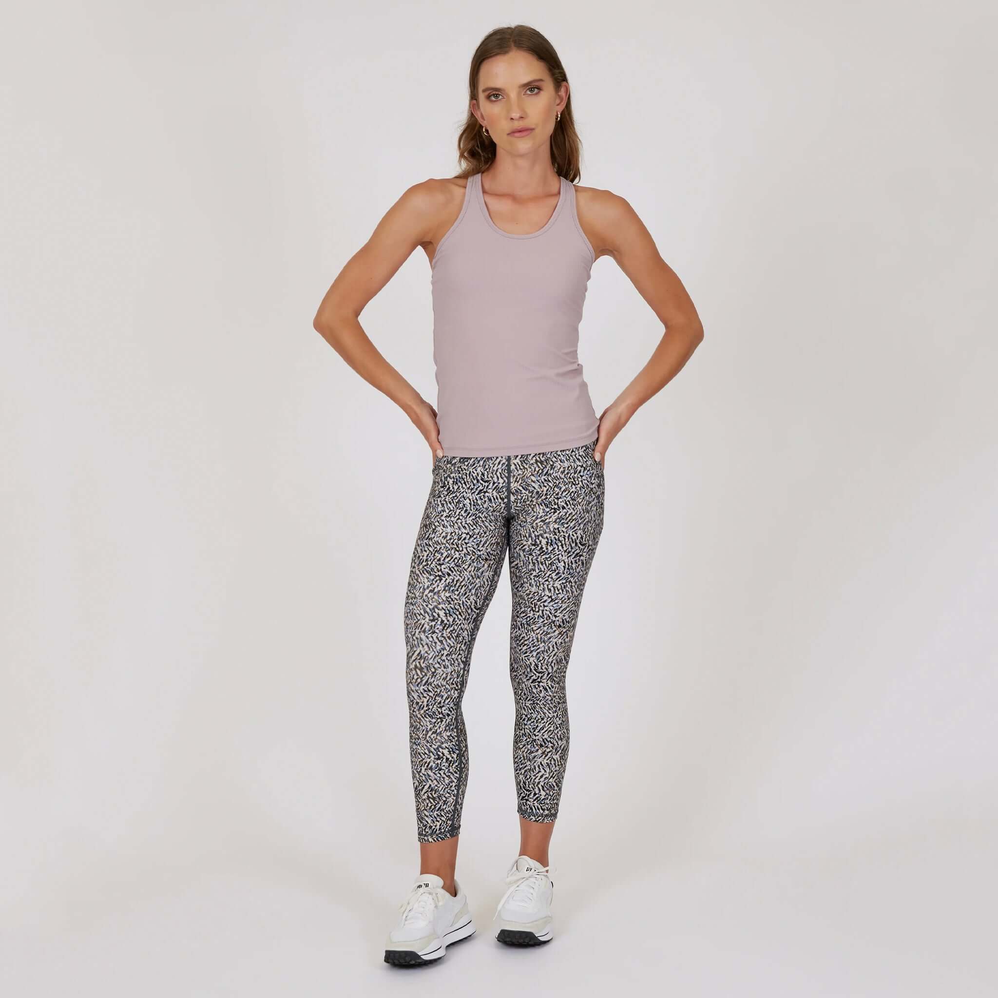 Model wearing Marlow Contour Air Tank - Rose Beige with patterned leggings and white sneakers.
