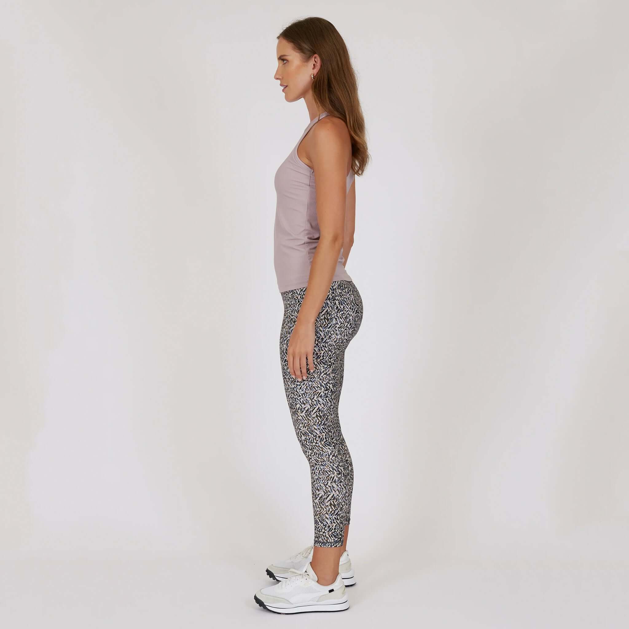 Marlow Contour Air Tank - Rose Beige worn with leggings in a side view, showcasing its fit and design.