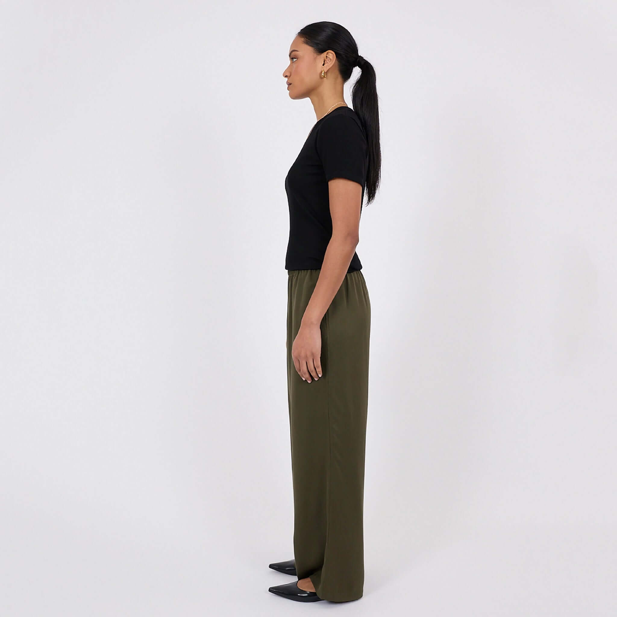 Marlow Eclipse Wide Leg Pants - Spruce shown in a side view, highlighting the fluid drape and comfort.