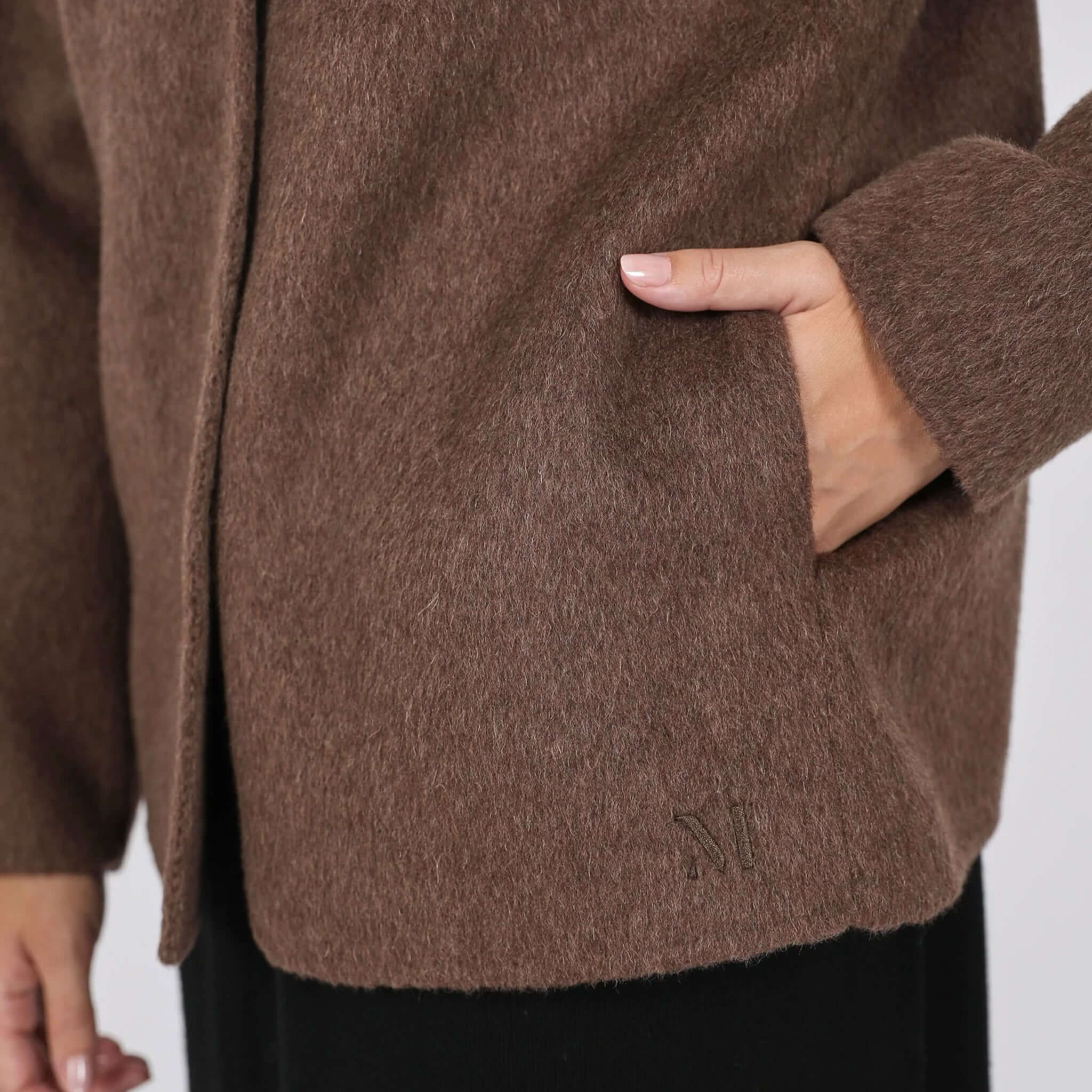 Close-up of the Marlow Loft Wool Coat - Mushroom showcasing the soft texture and pocket detail.