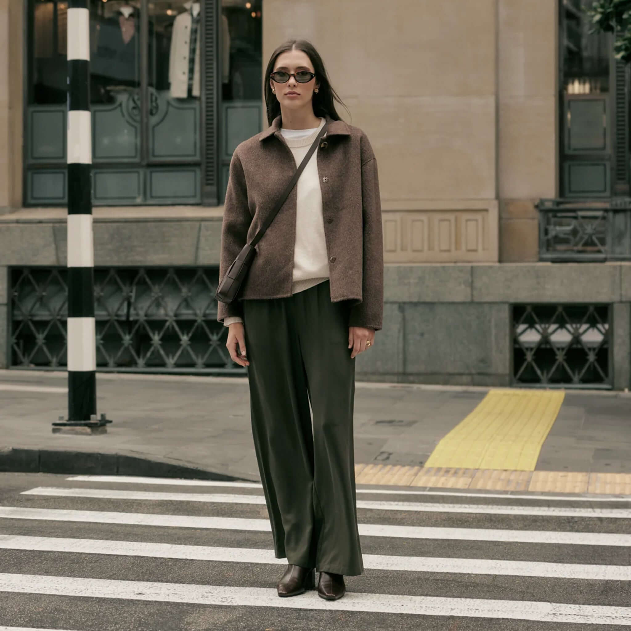 Marlow Loft Wool Coat - Mushroom worn by a model in urban setting, showcasing its sleek style and soft texture.