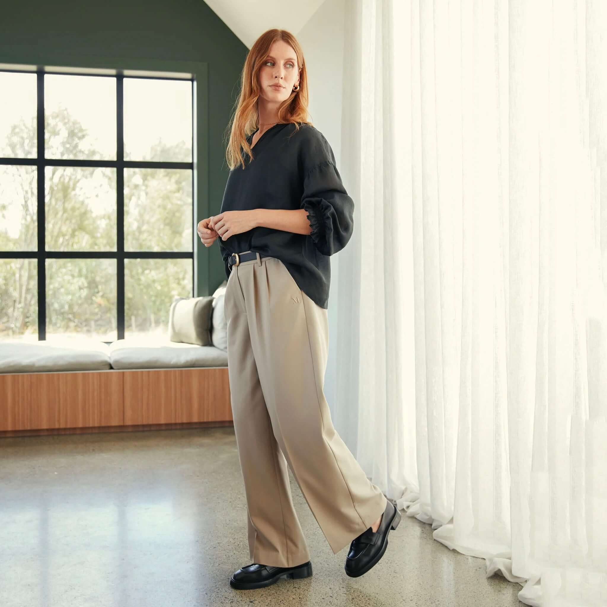 Alt Tag: Marlow Mode Pants - Ecru wide-leg full-length pants with front pleats, elasticated back and pockets, styled with black top