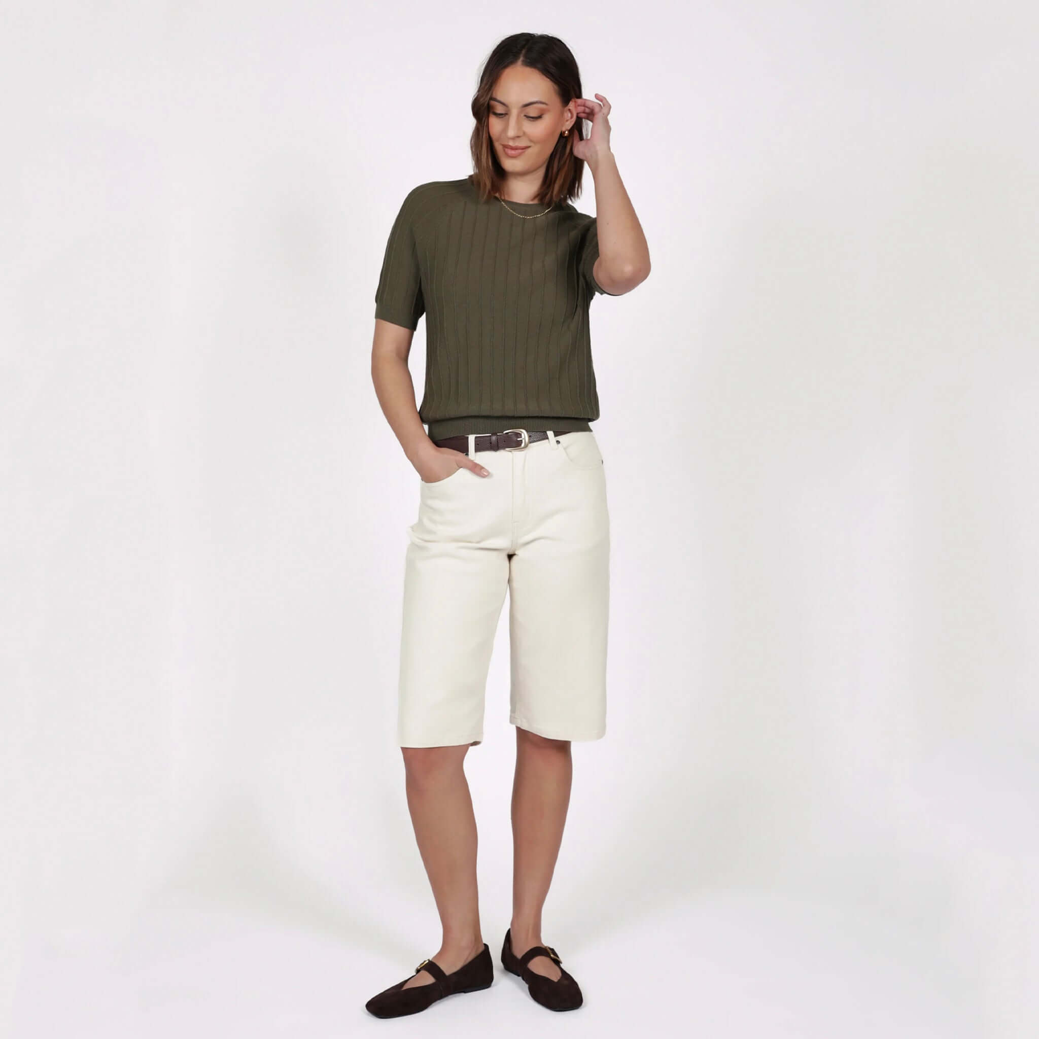 Marlow Soleil Knit Tee - Olive worn with cream shorts for a stylish summer look.