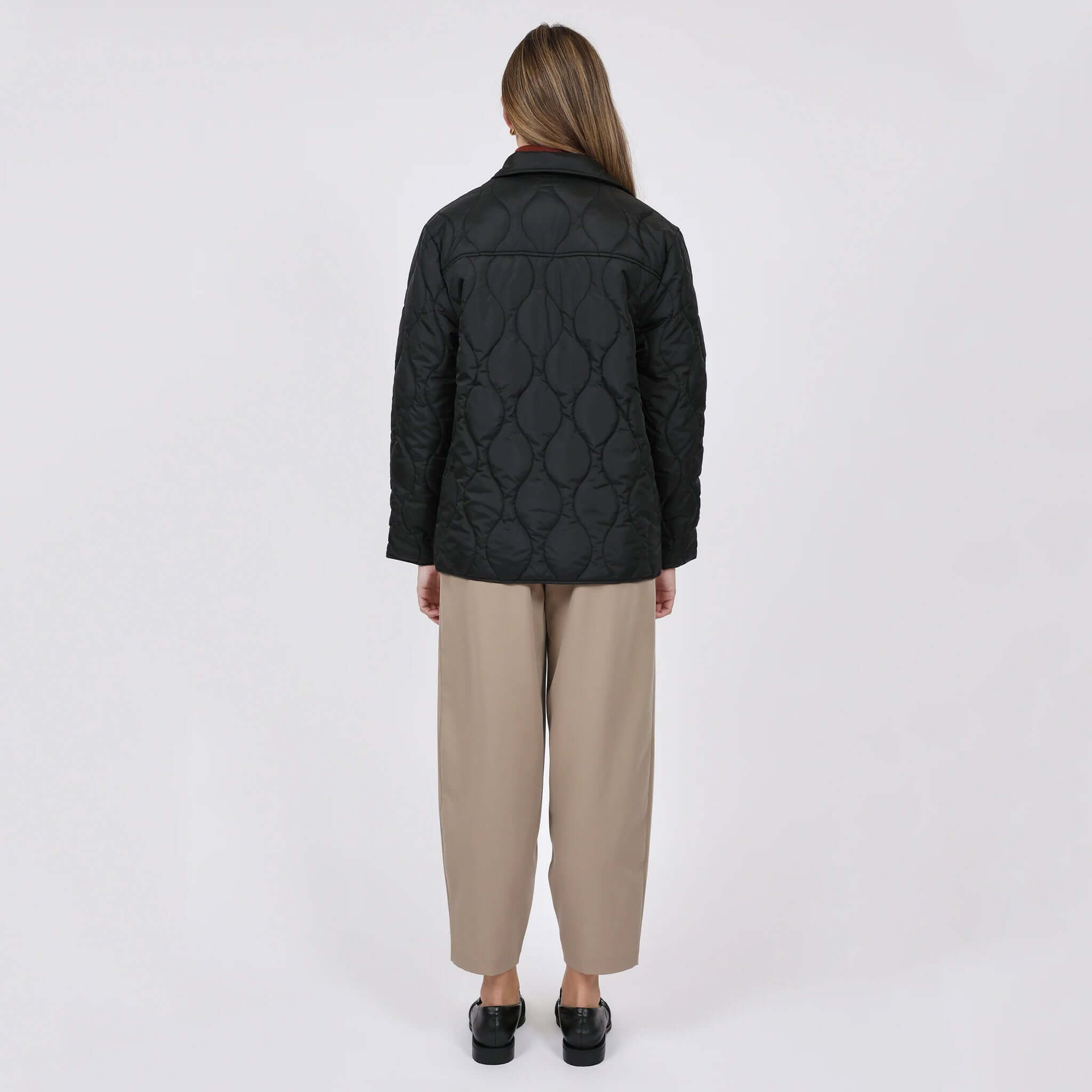 Marlow Toronto Quilted Jacket - Black worn from the back, showcasing its quilted design and relaxed silhouette.