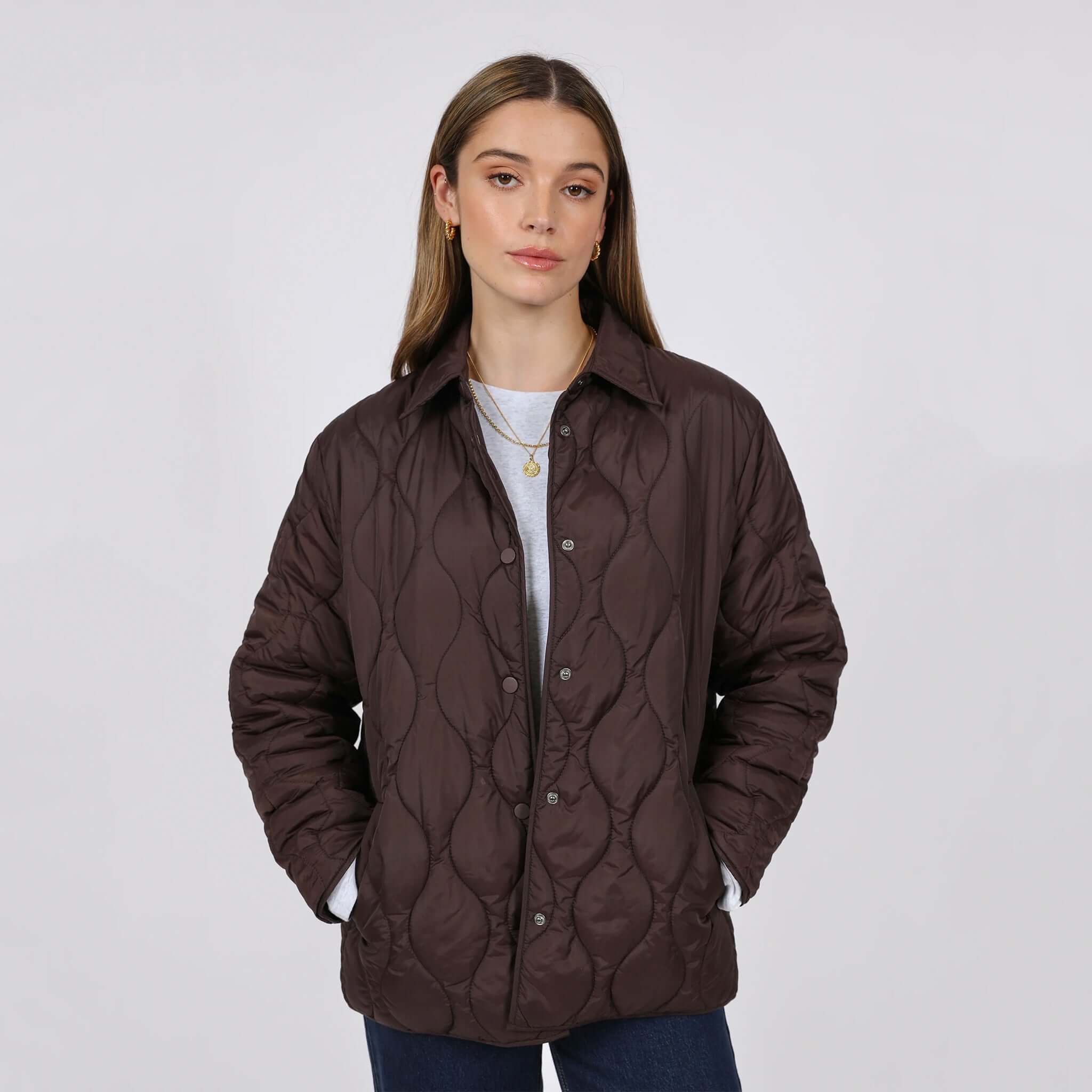 Marlow Toronto Quilted Jacket - Java worn by a model, showcasing its modern wave-quilted design in a refined dark brown shade.