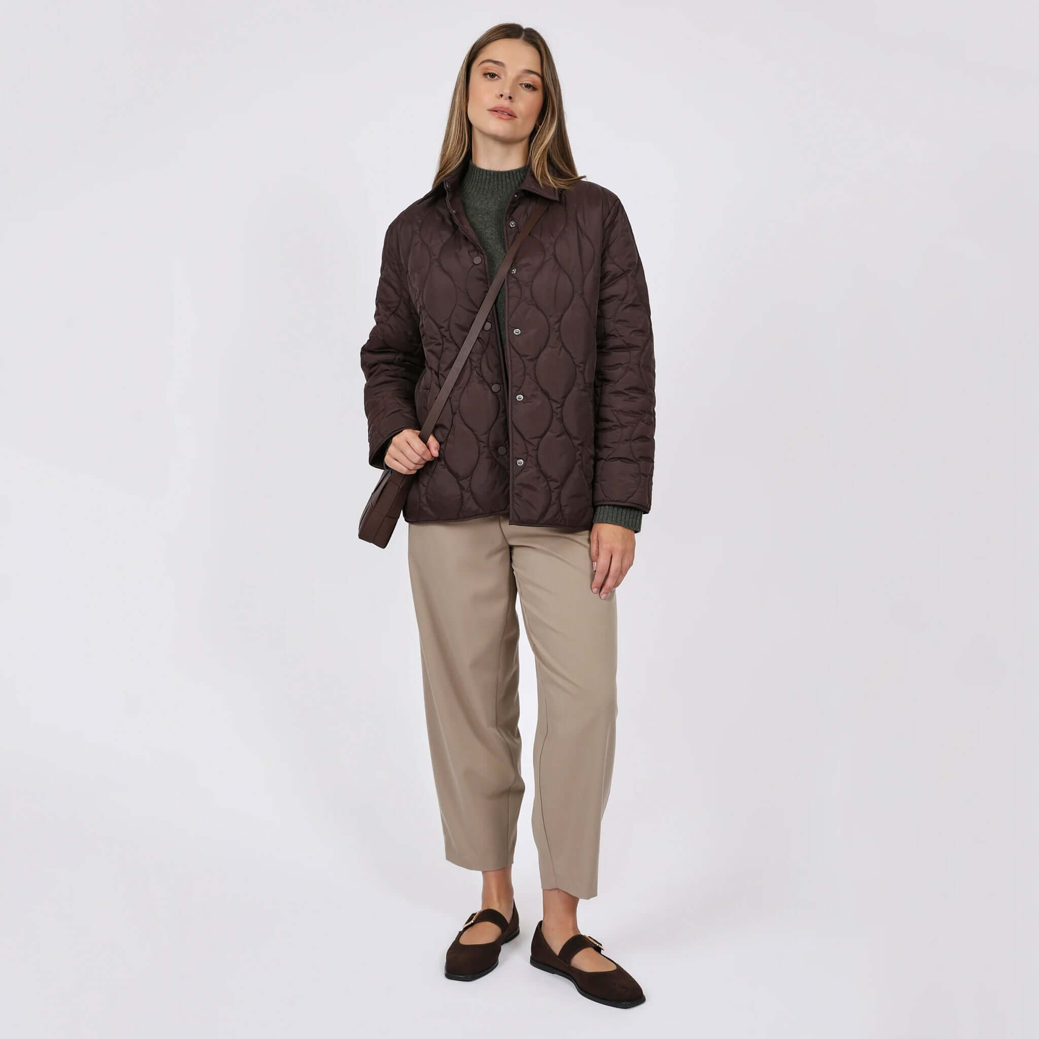 Marlow Toronto Quilted Jacket - Java worn by a woman, featuring a quilted design, relaxed fit, and medium-weight warmth.