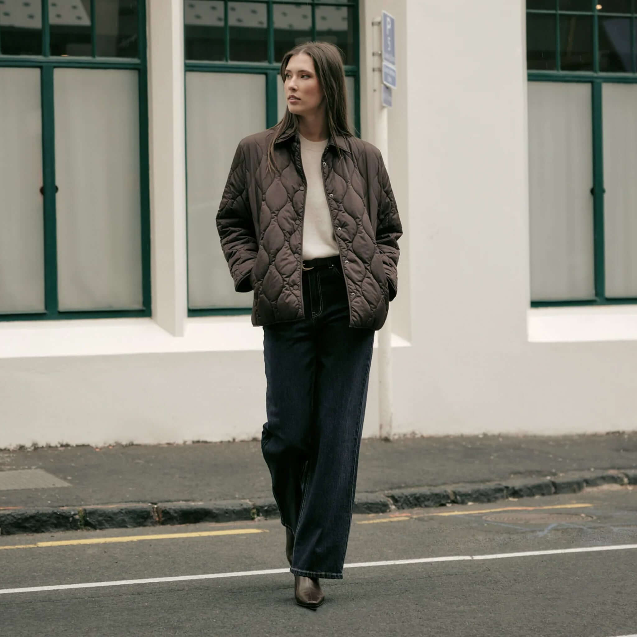 Model wearing Marlow Toronto Quilted Jacket - Java with relaxed silhouette on urban street.