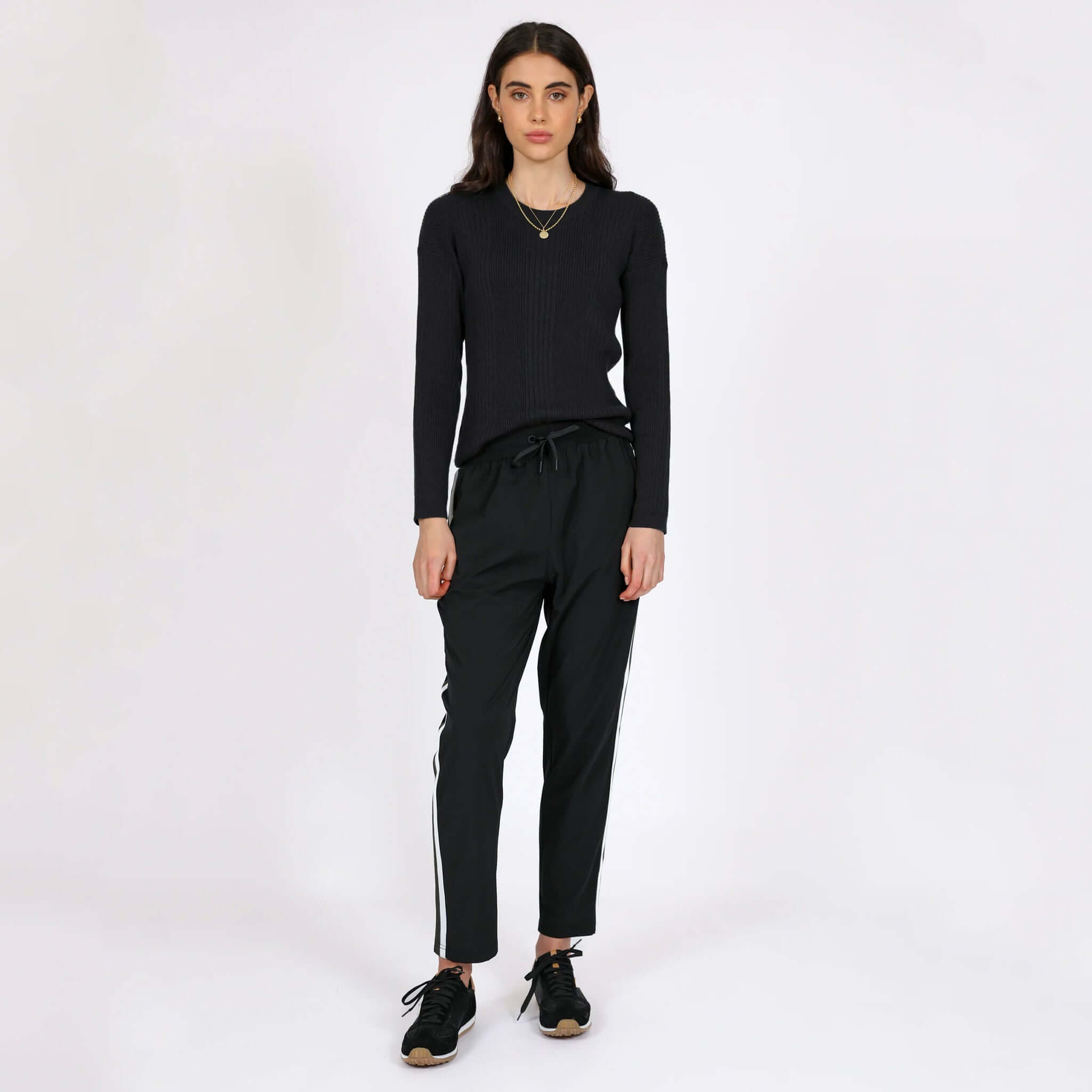 Alt Tag: Marlow Transit Pants - Black on model, featherlight stretch travel pants with drawstring waist, breathable quick-dry wrinkle-resistant