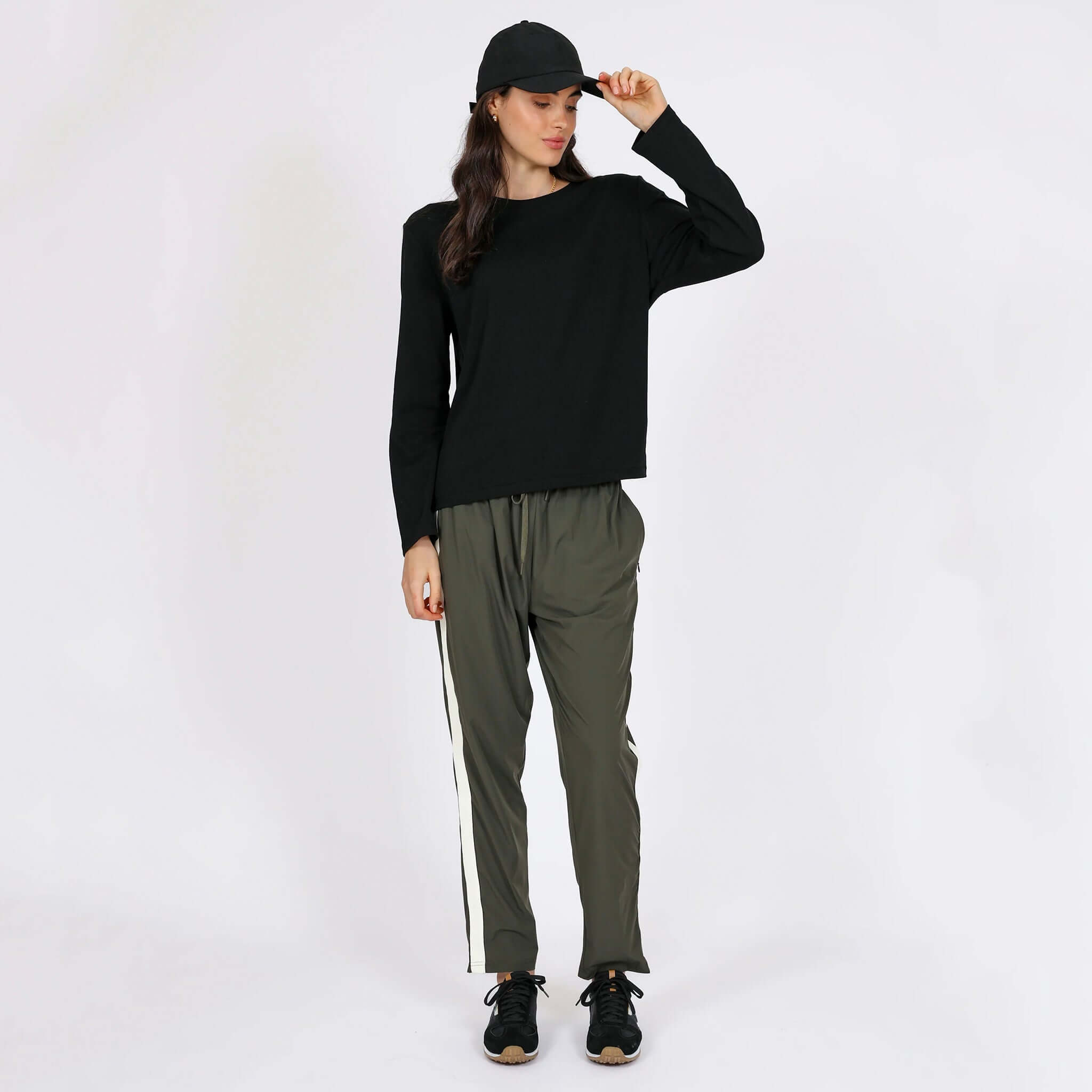 Alt Tag: Marlow Transit Pants - Olive on model, featherlight stretch quick-dry travel pants with breathable wrinkle-resistant comfort