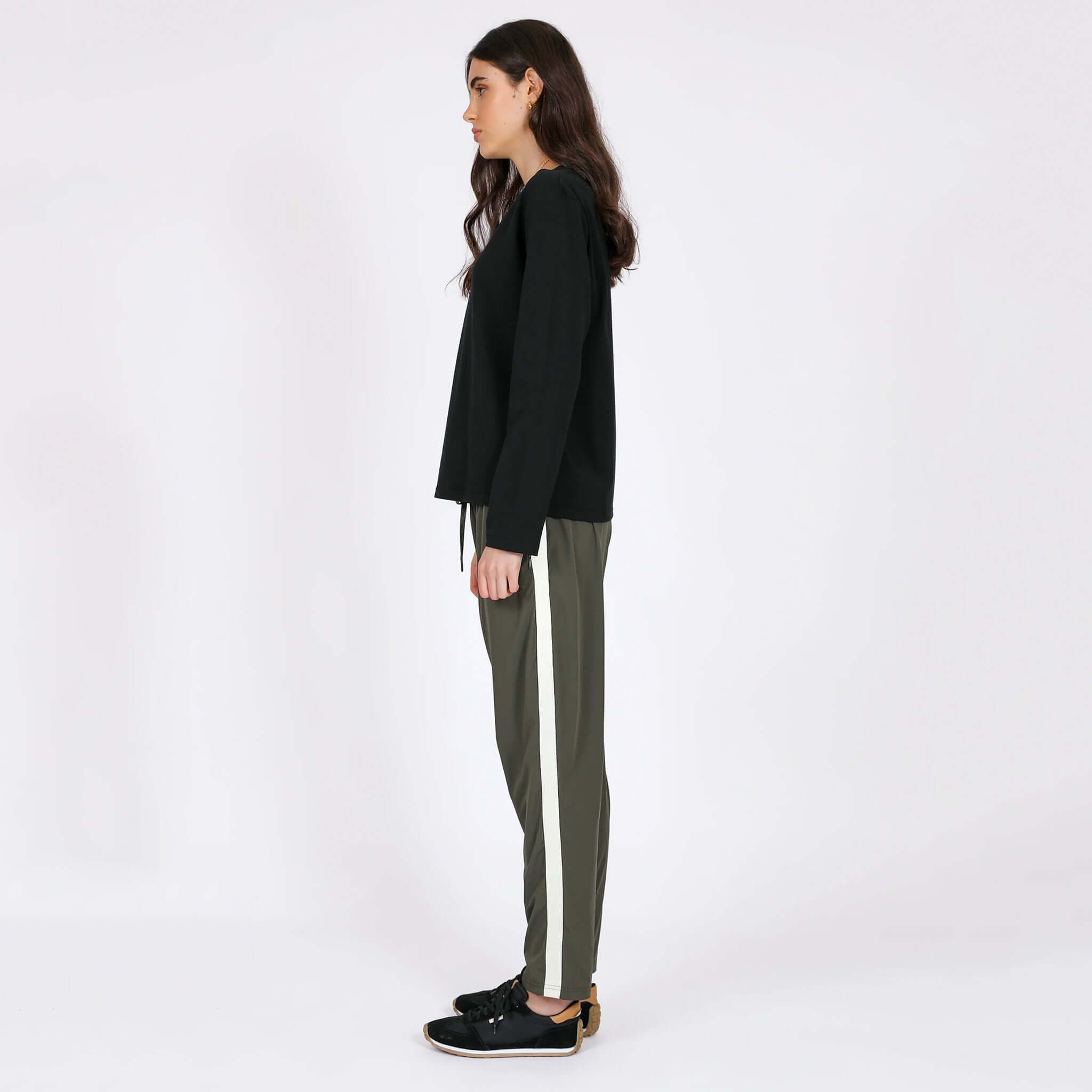 Alt Tag: Marlow Transit Pants - Olive side view on model, featherlight stretch travel pants, quick-drying breathable wrinkle-resistant fit